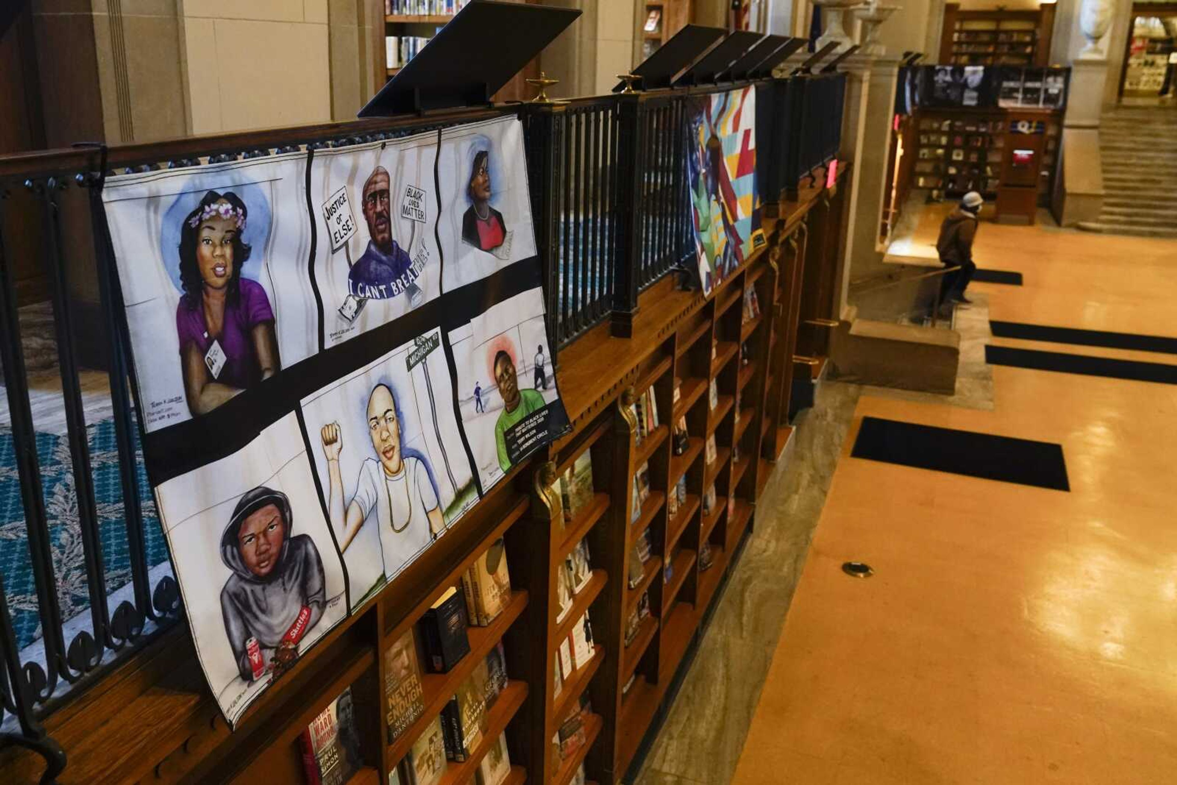 Vinyl banners representing the 24 murals that were painted in the downtown area of Indianapolis are displayed Thursday at the Central Library.