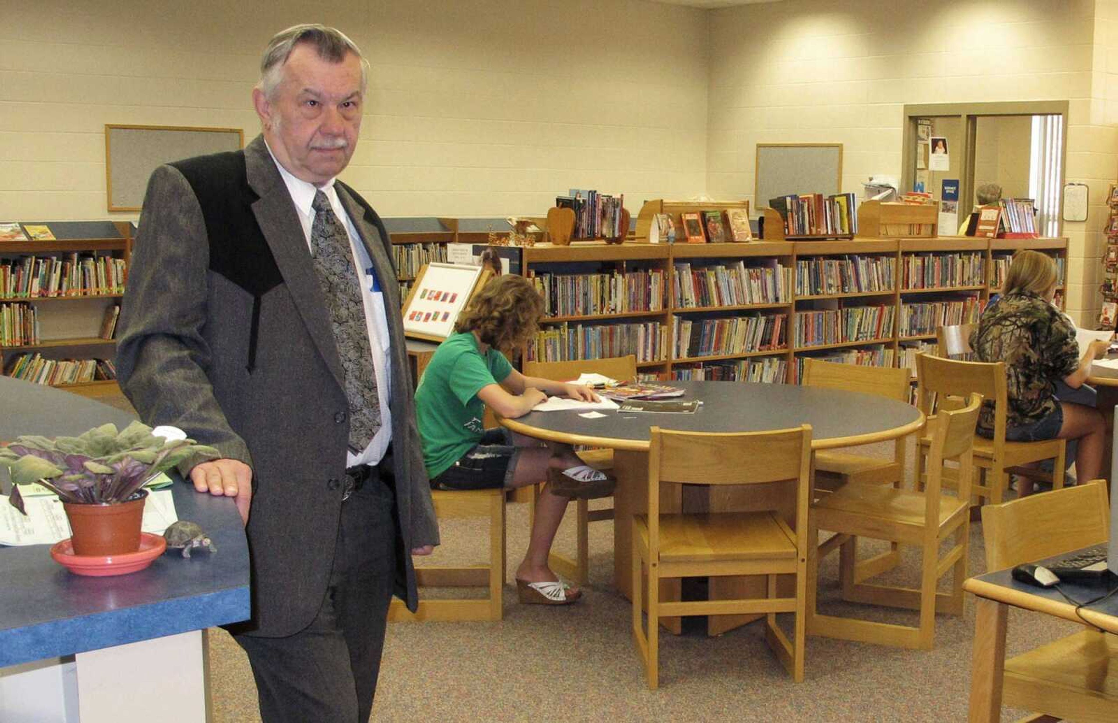 In this May 18, 2011 photo, Irene-Wakonda School District Superintendent Larry Johnke stands in the lrene-Wakonda High School school library in Irene, S.D. This district, in the rolling farmland of southeastern South Dakota, is among a growing number that have adopted a four-day school week as the best option for cutting costs as state funding for schools is reduced. (AP Photo/Chet Brokaw)