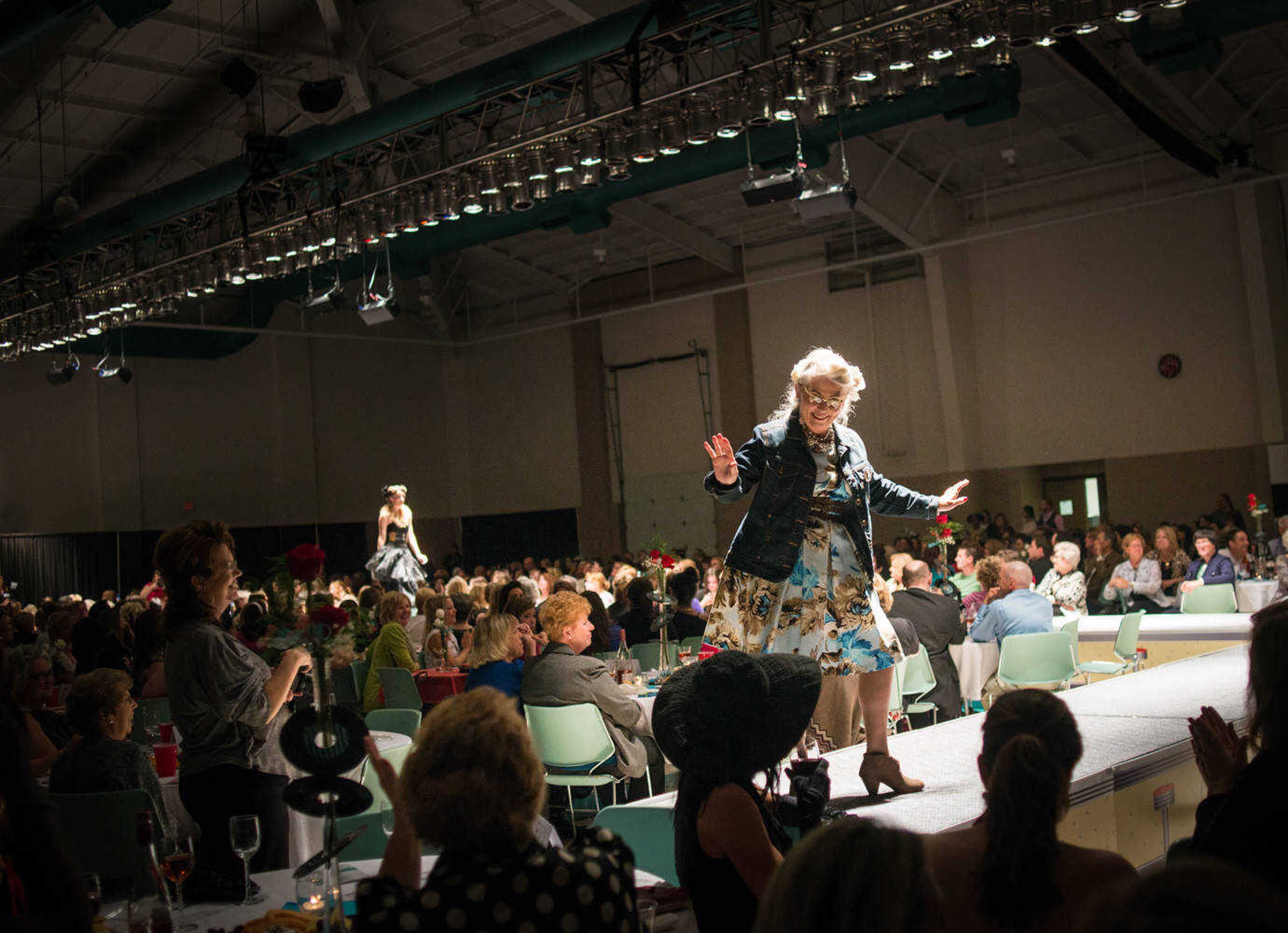 AARON EISENHAUER ~ photos@semissourian.com
Lynn Moore poses on the runway during the fifth annual VintageNOW fashion show, a fundraiser for Safe House for Women, at the Osage Centre on Friday, October 17, 2014.