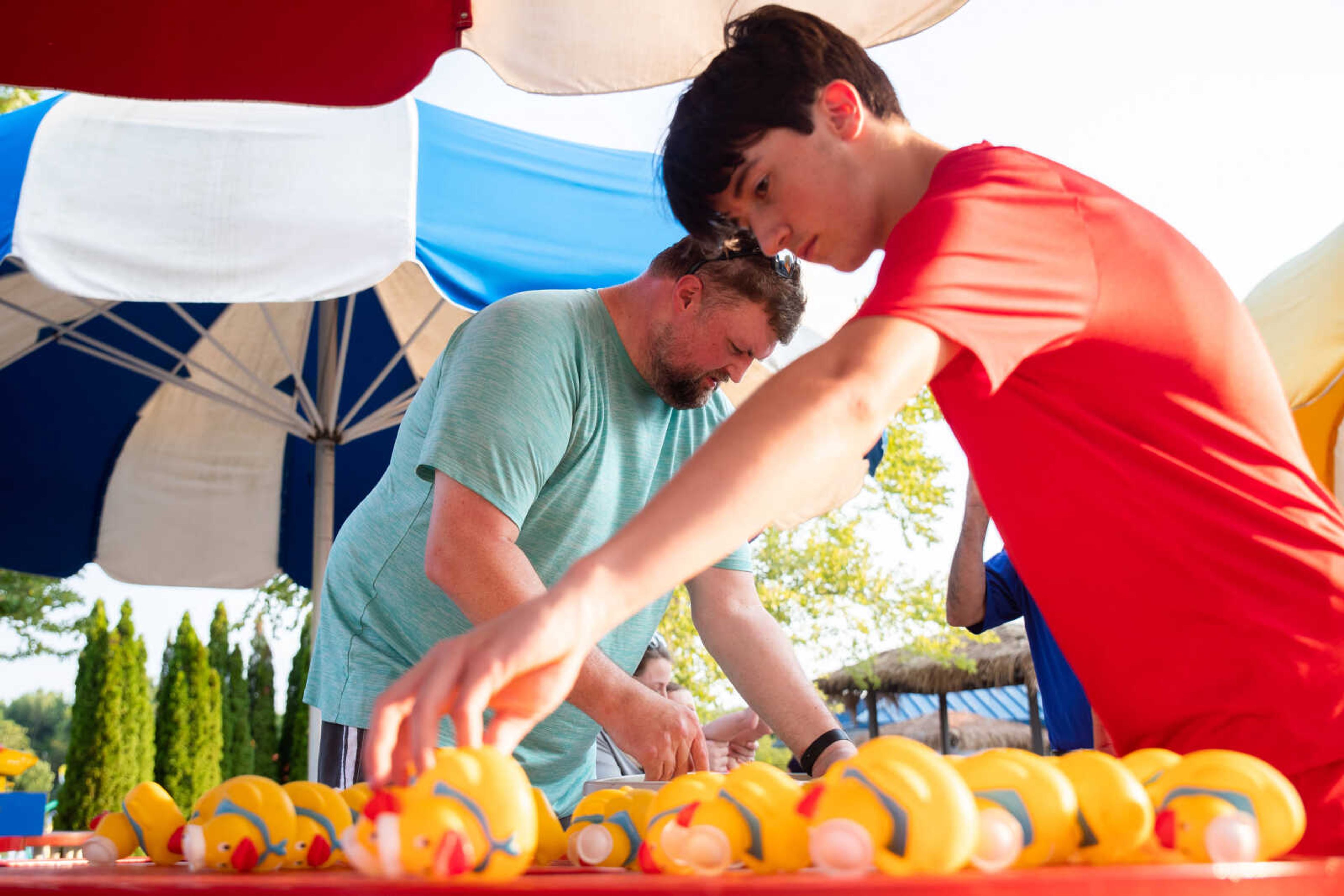 Finn Gorman and&nbsp;Chris McAuley, left, prepare the rubber ducks for the Duck Regatta.