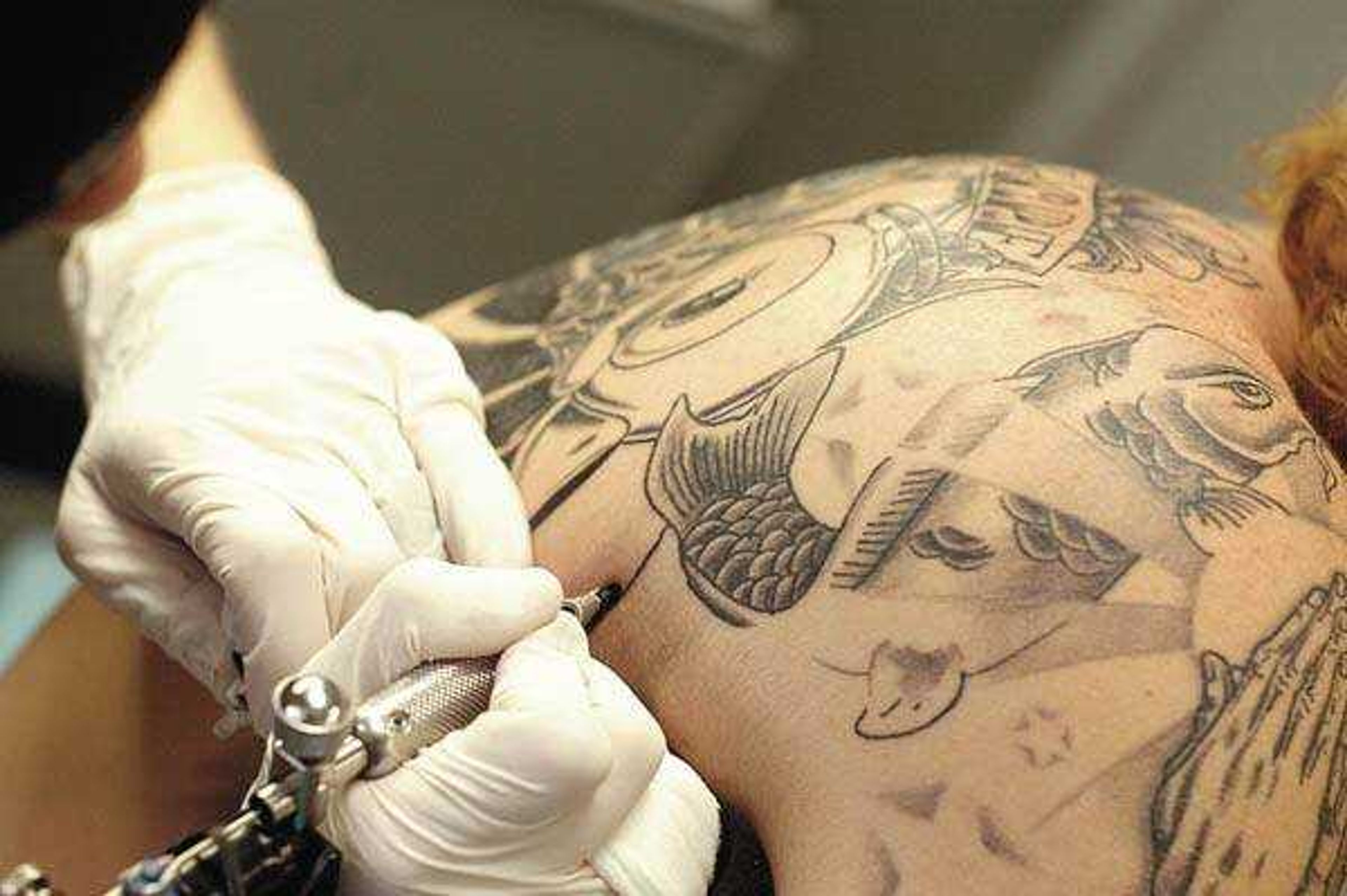 Tattoo artist Jake French at work (Photo by Aaron Eisenhauer)