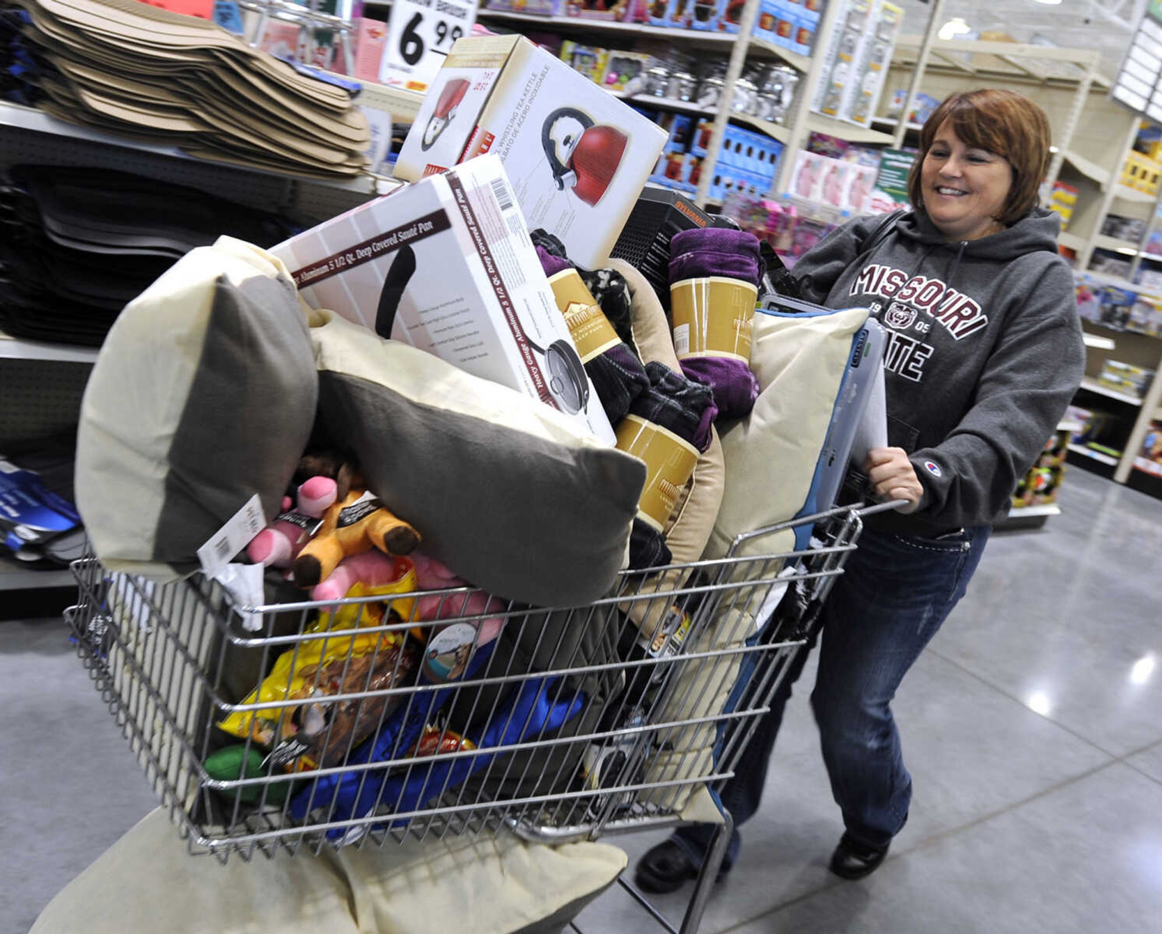 FRED LYNCH ~ flynch@semissourian.com
Christy Cook of Oran, Mo. heads to the check-out after shopping at Menards on Friday, Nov. 23, 2012 in Cape Girardeau.