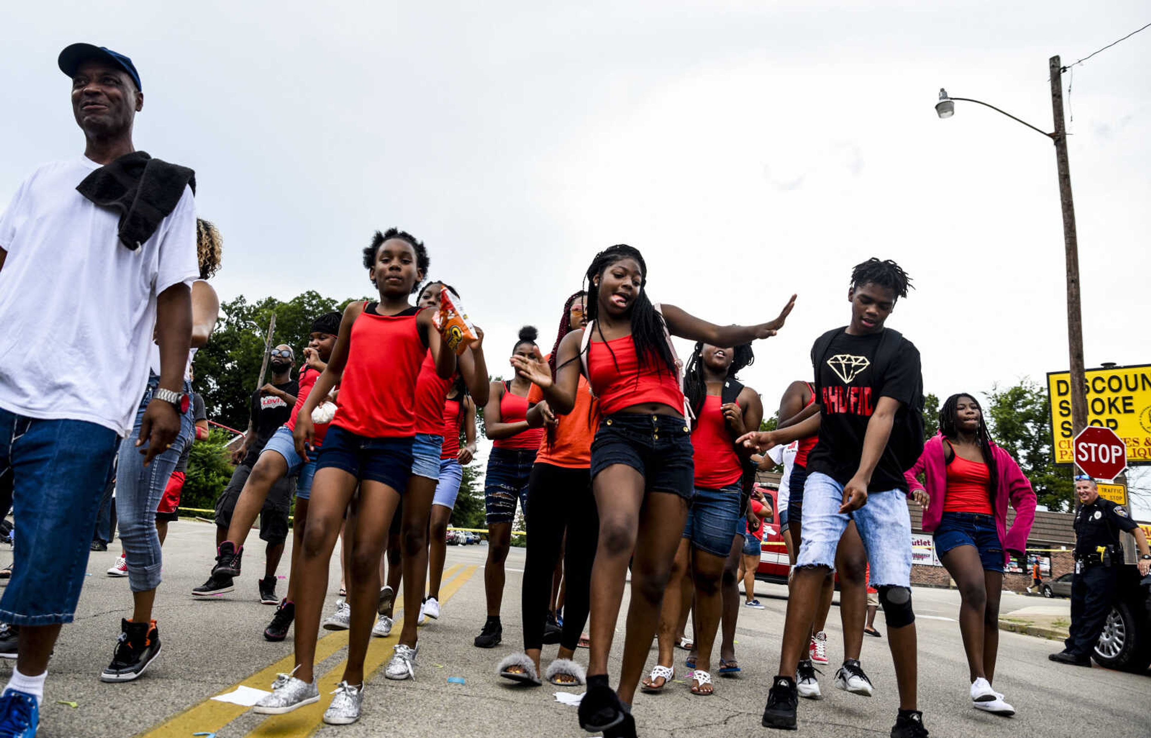 Community members dance to the Cupid Shuffle during the S.N.A.P. open house block party Saturday, July 14, 2018 in Cape Girardeau.