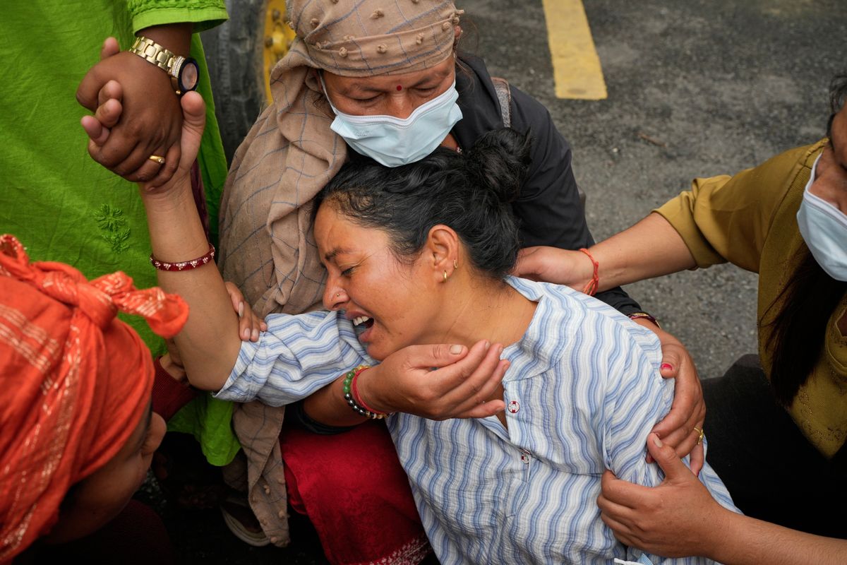 Photos show one family in Nepal bid farewell, as other flood...