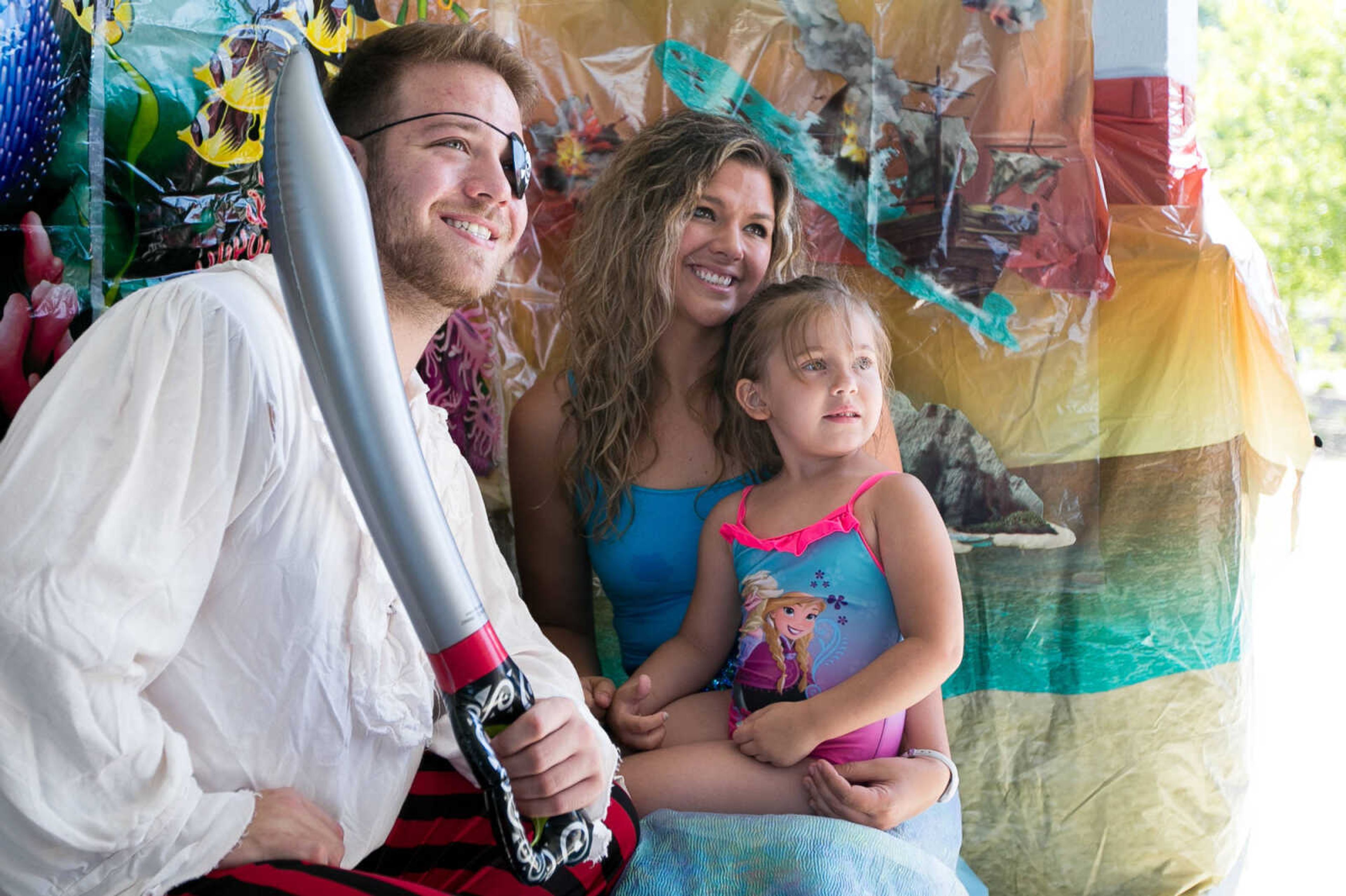 GLENN LANDBERG ~ glandberg@semissourian.com

Sky Max poses for a photo with Black Beard the Pirate and Ariel the Mermaid during the Mermaid and Pirate Party at Cape Splash Saturday, June 18, 2016 in Cape Girardeau.