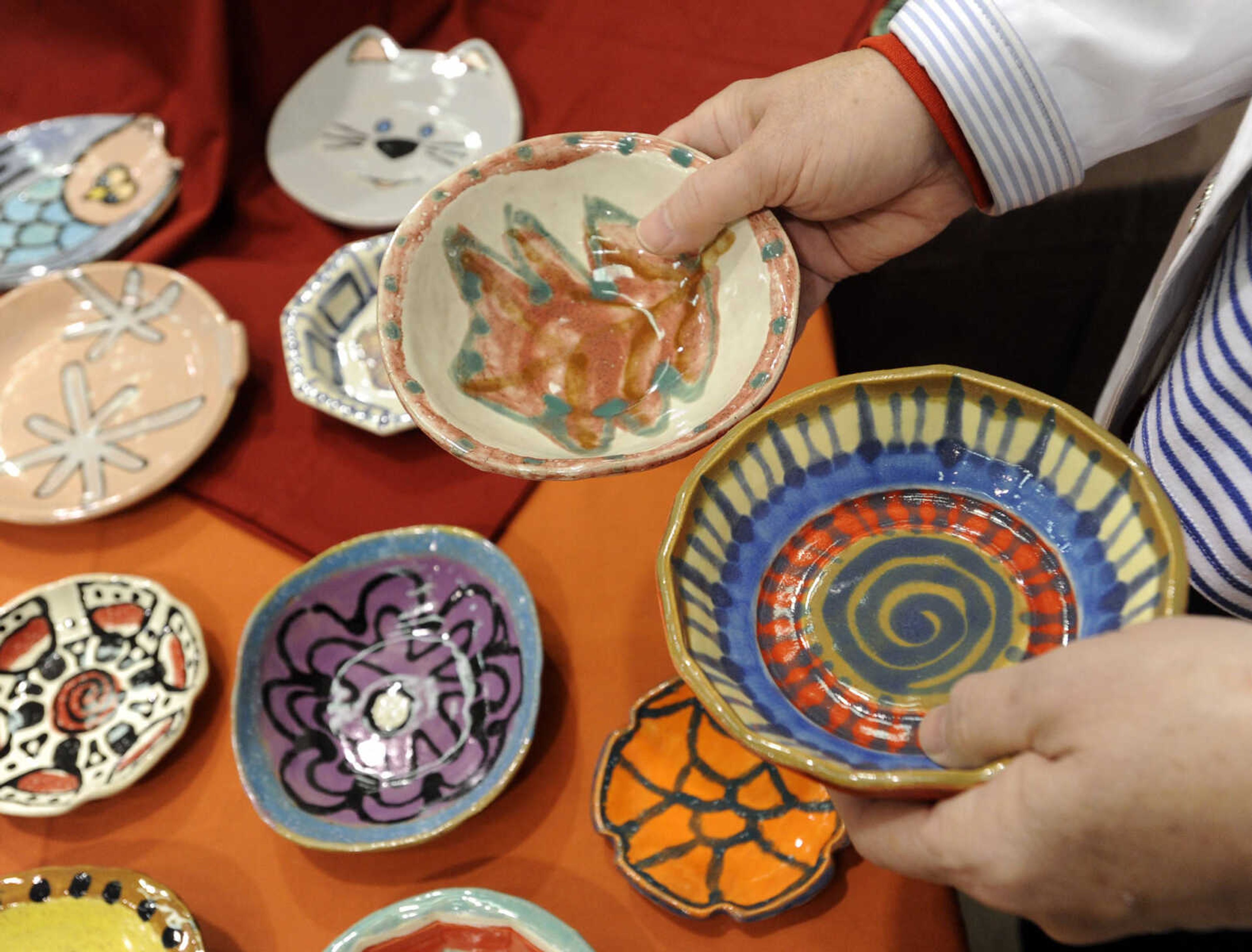 Choices are made at the ninth annual Empty Bowls Banquet on Sunday, Nov. 2, 2014 at the Salvation Army Worship and Community Center in Cape Girardeau.