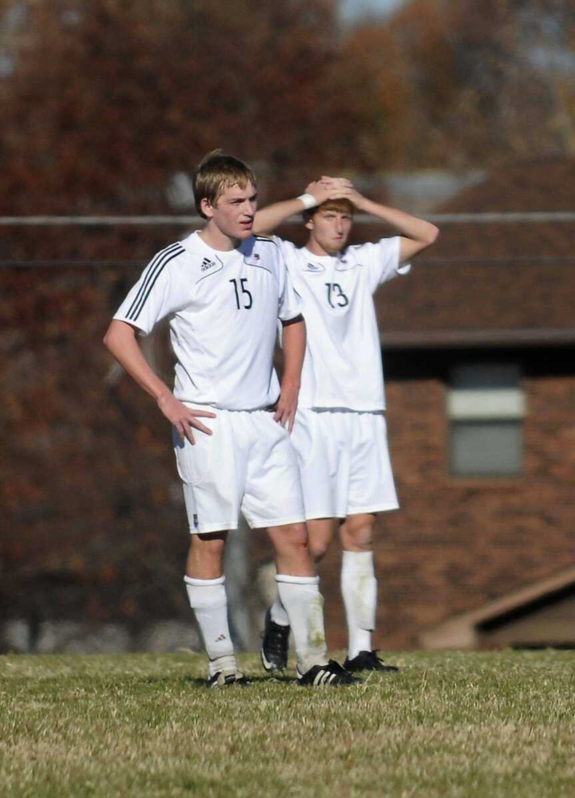 Jackson's Hunter Garrison, left, and Cody Boehme react after Saint Louis University High scored its third goal of the game during the second half Saturday in Jackson. (Kristin Eberts)