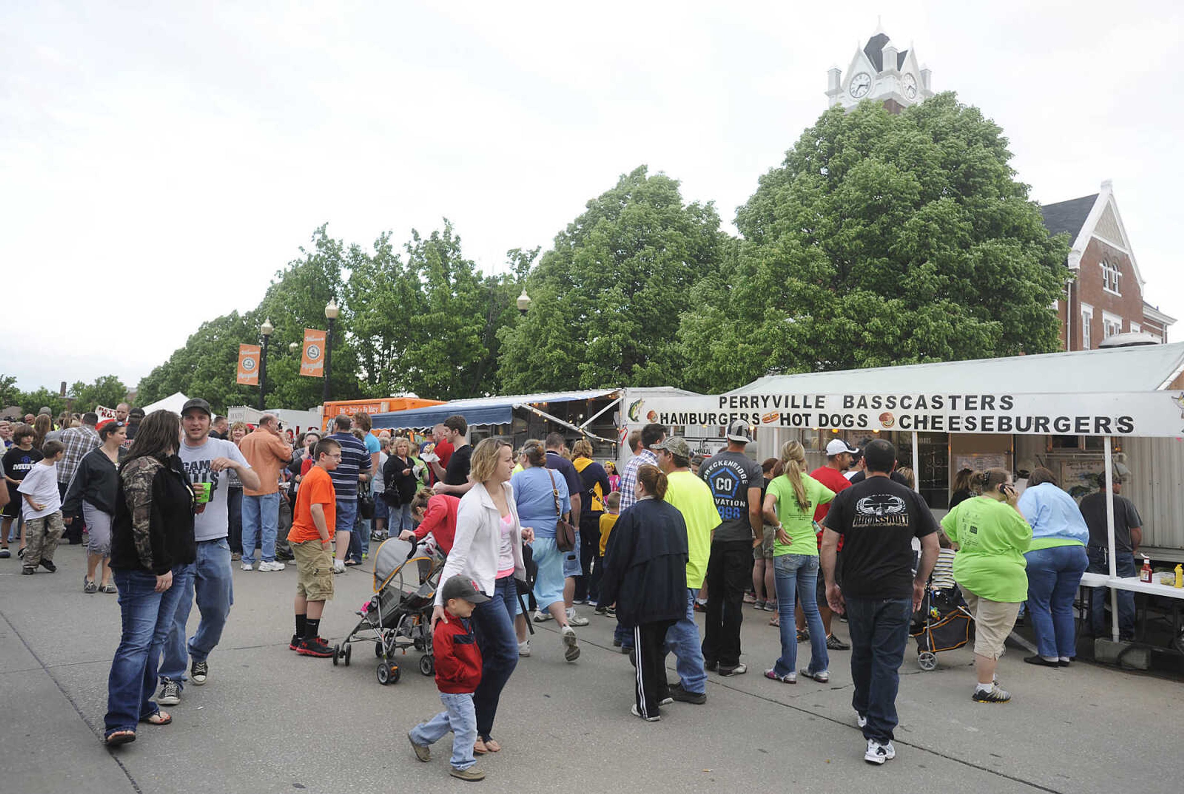 Attendees browse the food options during Perryville Mayfest Friday, May 10, in Perryville, Mo. This year's Mayfest theme is Peace, Love, Perryville Mayfest.