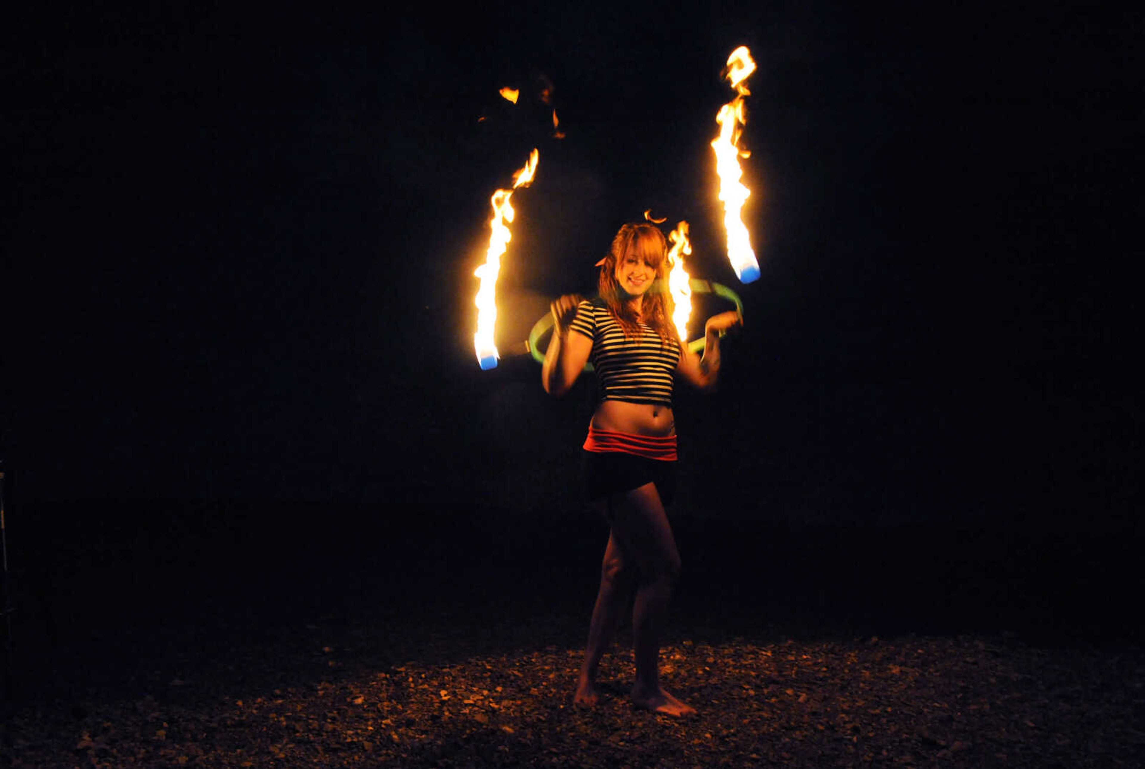 LAURA SIMON ~ lsimon@semissourian.com

Chelsie Welker fire hoops in a Cape Girardeau County creek, Tuesday, May 26, 2015.