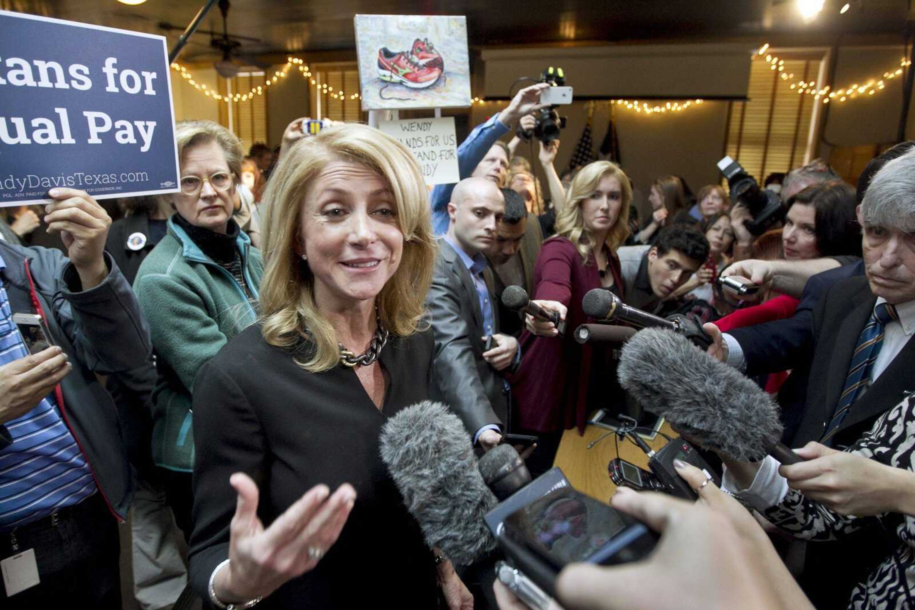 Texas Democratic gubernatorial candidate Wendy Davis, center, speaks to supporters in Austin, Texas, on March 24. (AP Photo/Austin American-Statesman, Laura Skelding, File)