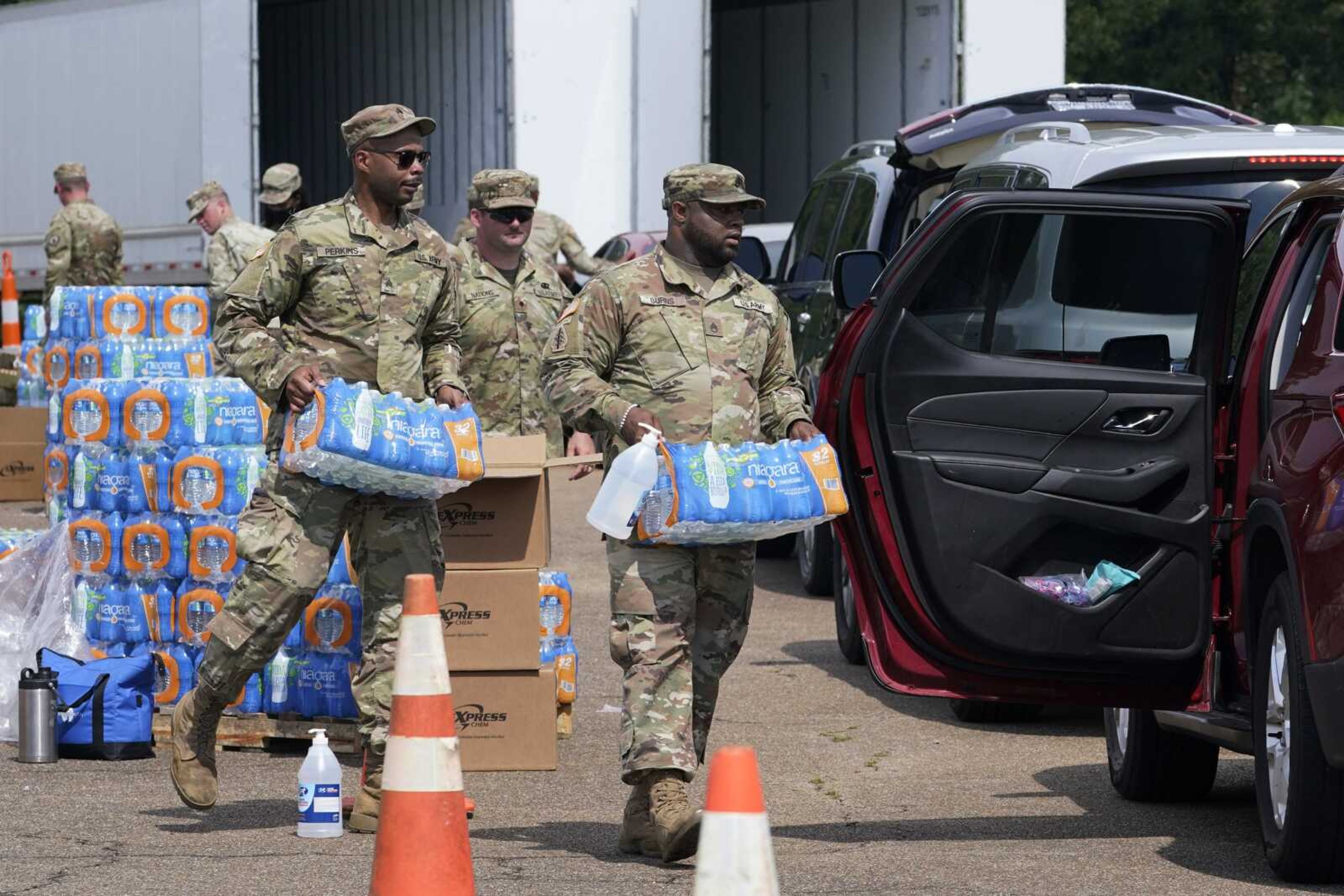 Members of the Mississippi National Guard distribute water and supplies to Jackson residents Friday in Jackson, Mississippi.