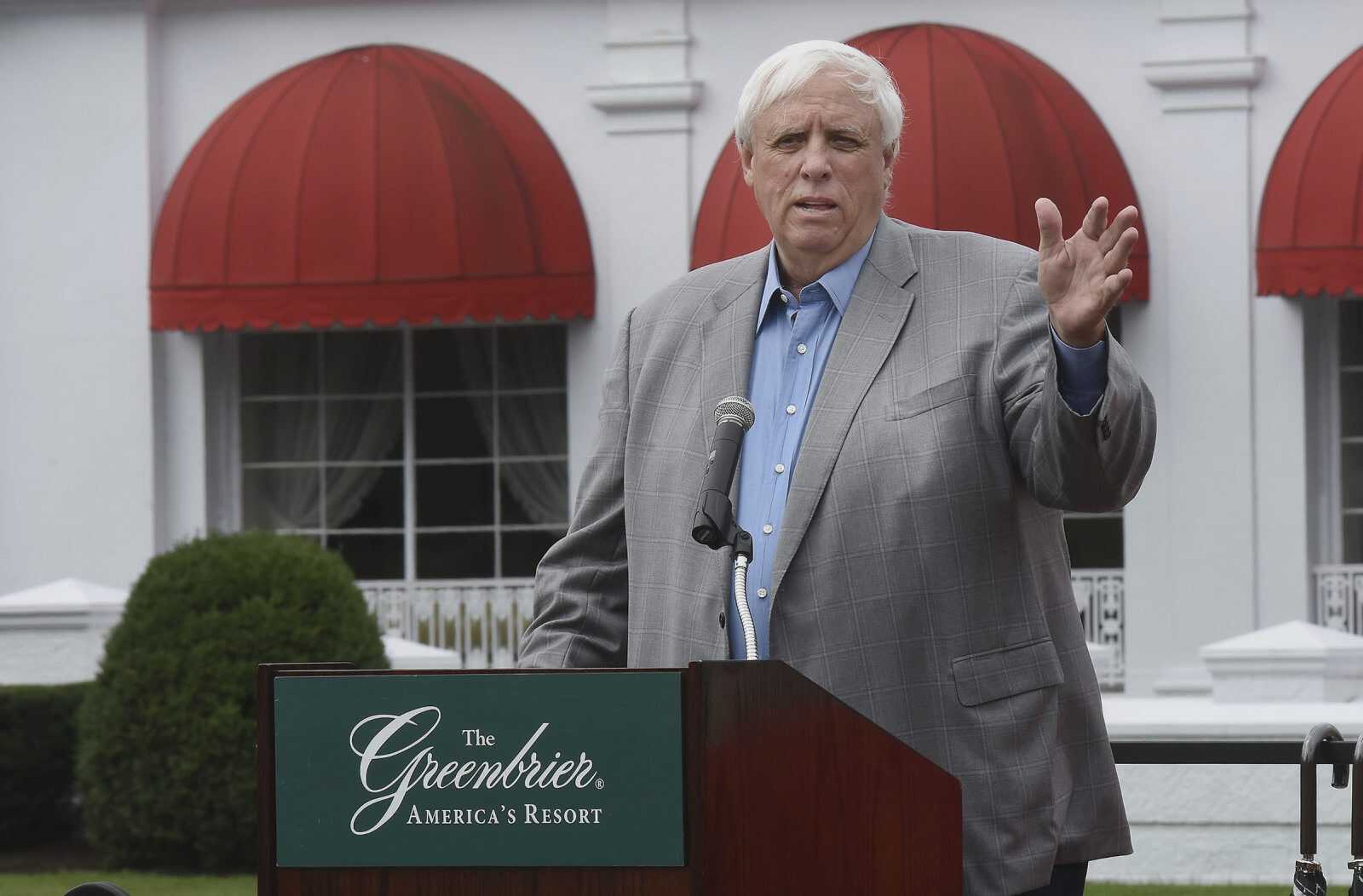 Gov. Jim Justice, owner of The Greenbrier Resort, speaks during a 2016 news conference in front of the hotel in White Sulphur Springs West Virginia.