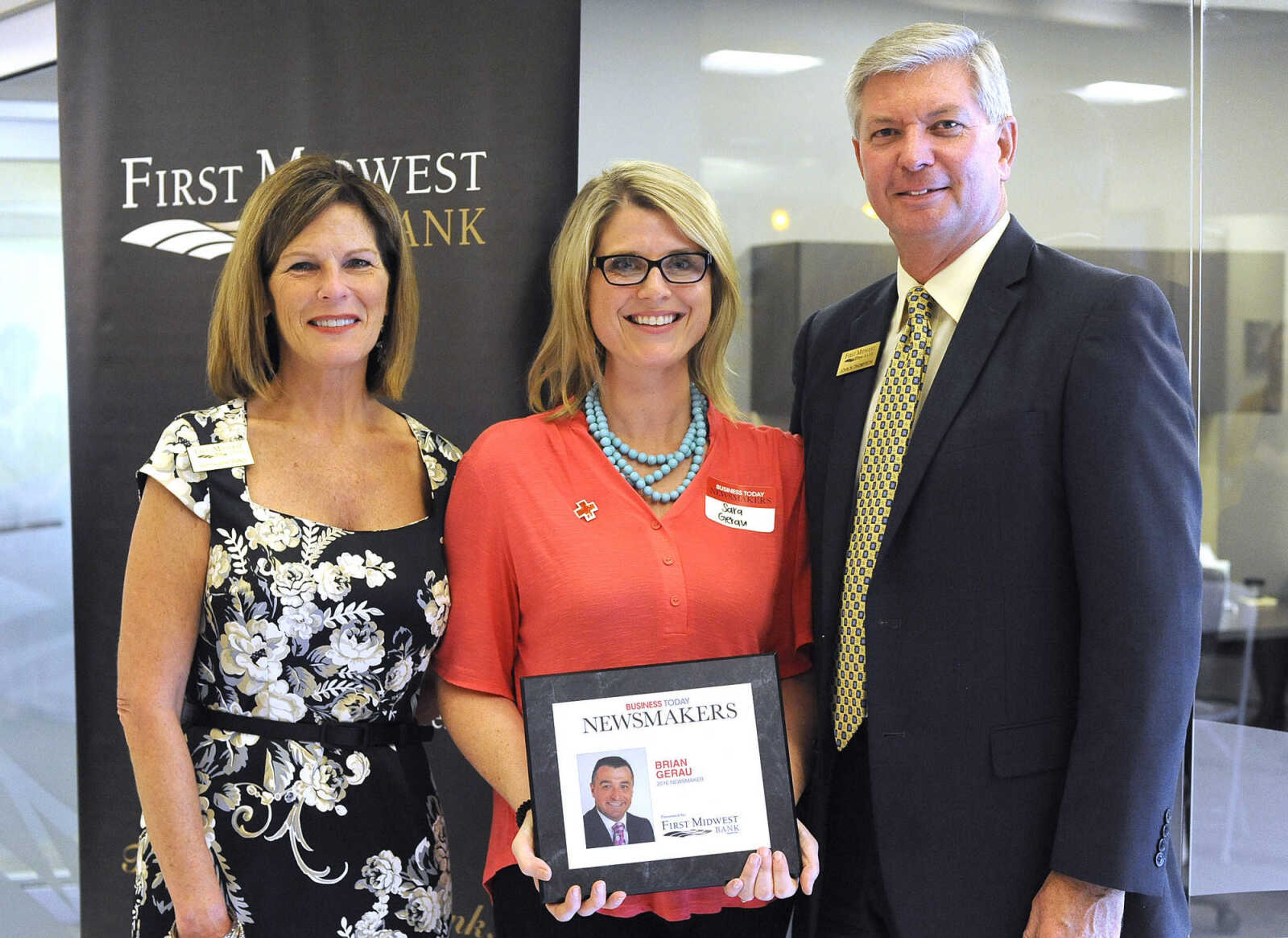 Sara Gerau, standing in for her husband, Brian Gerau, poses for a photo with Kathy Bertrand, First Midwest Bank community bank president, Cape Girardeau, and John N. Thompson, First Midwest Bank community bank president, Jackson, Wednesday, Sept. 7, 2016 during the Business Today Newsmakers awards reception at First Midwest Bank in Cape Girardeau.