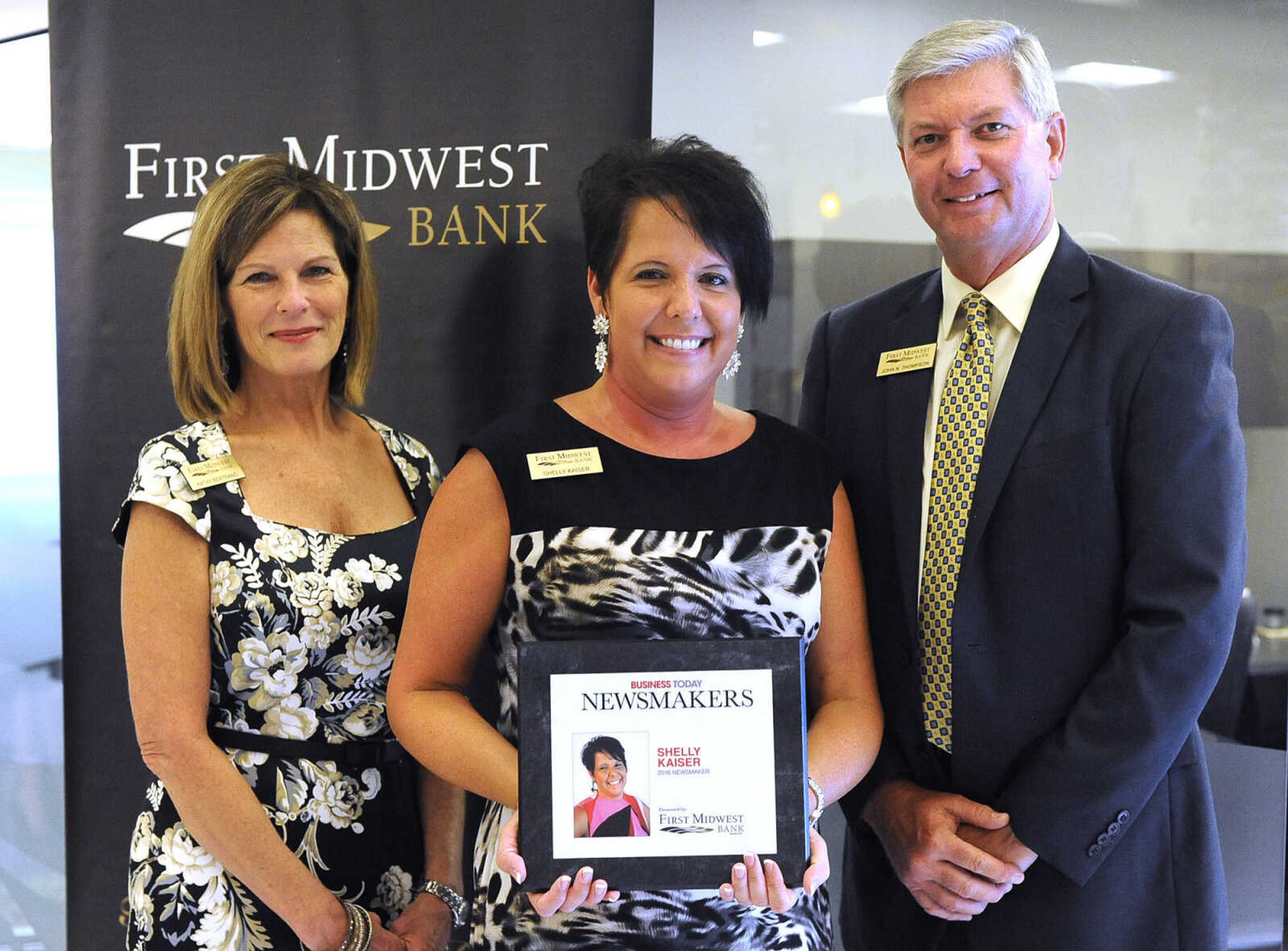 Shelly Kaiser poses for a photo with Kathy Bertrand, First Midwest Bank community bank president, Cape Girardeau, and John N. Thompson, First Midwest Bank community bank president, Jackson, Wednesday, Sept. 7, 2016 during the Business Today Newsmakers awards reception at First Midwest Bank in Cape Girardeau.