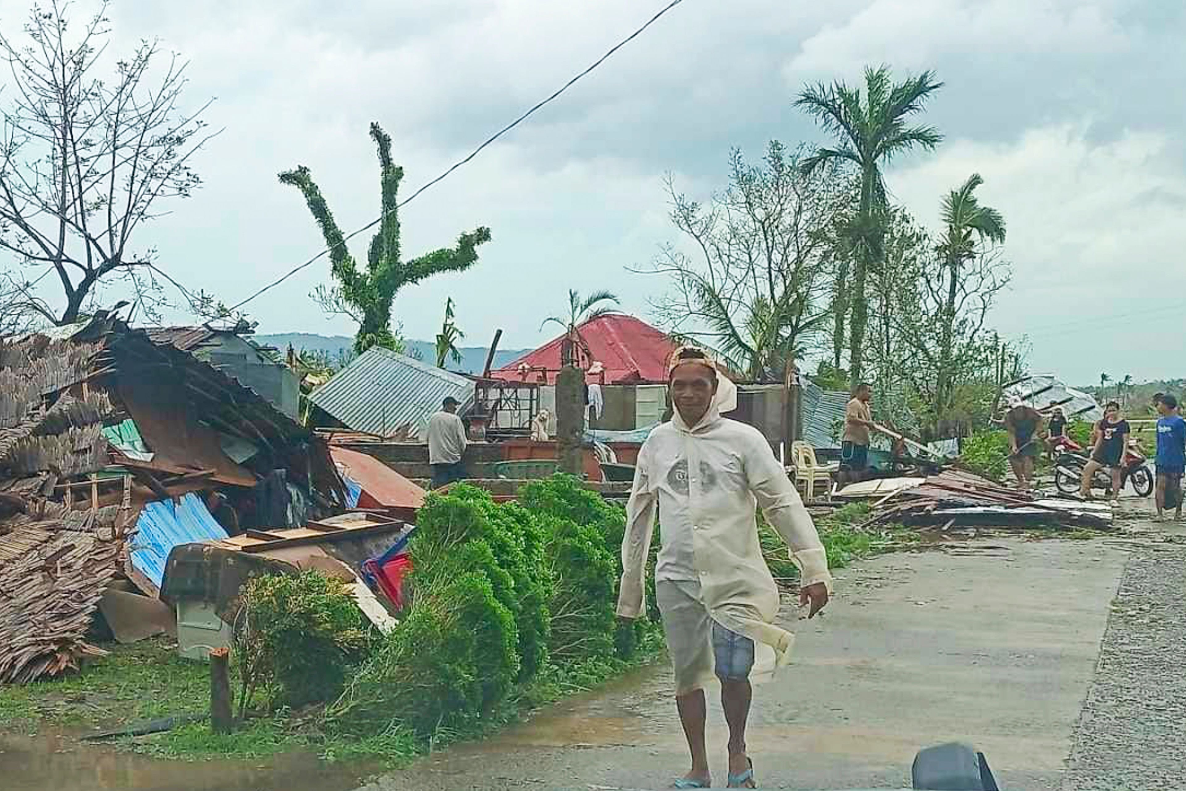 In this photo provided by the MDRRMO Viga Catanduanes, residents try to fix their damaged homes caused by Typhoon Man-yi in Viga, Catanduanes province, northeastern Philippines Sunday, Nov. 17, 2024. (MDRRMO Viga Catanduanes via AP)