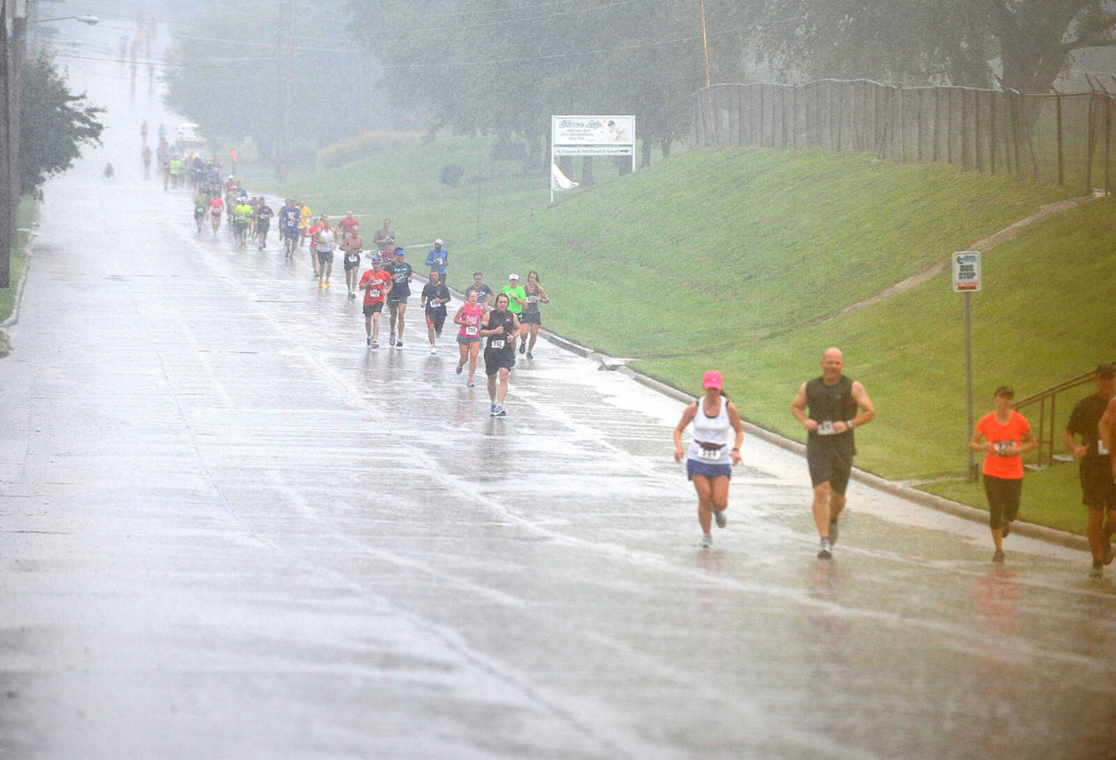 LAURA SIMON ~ lsimon@semissourian.com
Participants trek through the rain in Cape Girardeau Sunday morning, Sept. 16, 2012 during the City of Roses half marathon and 5k.