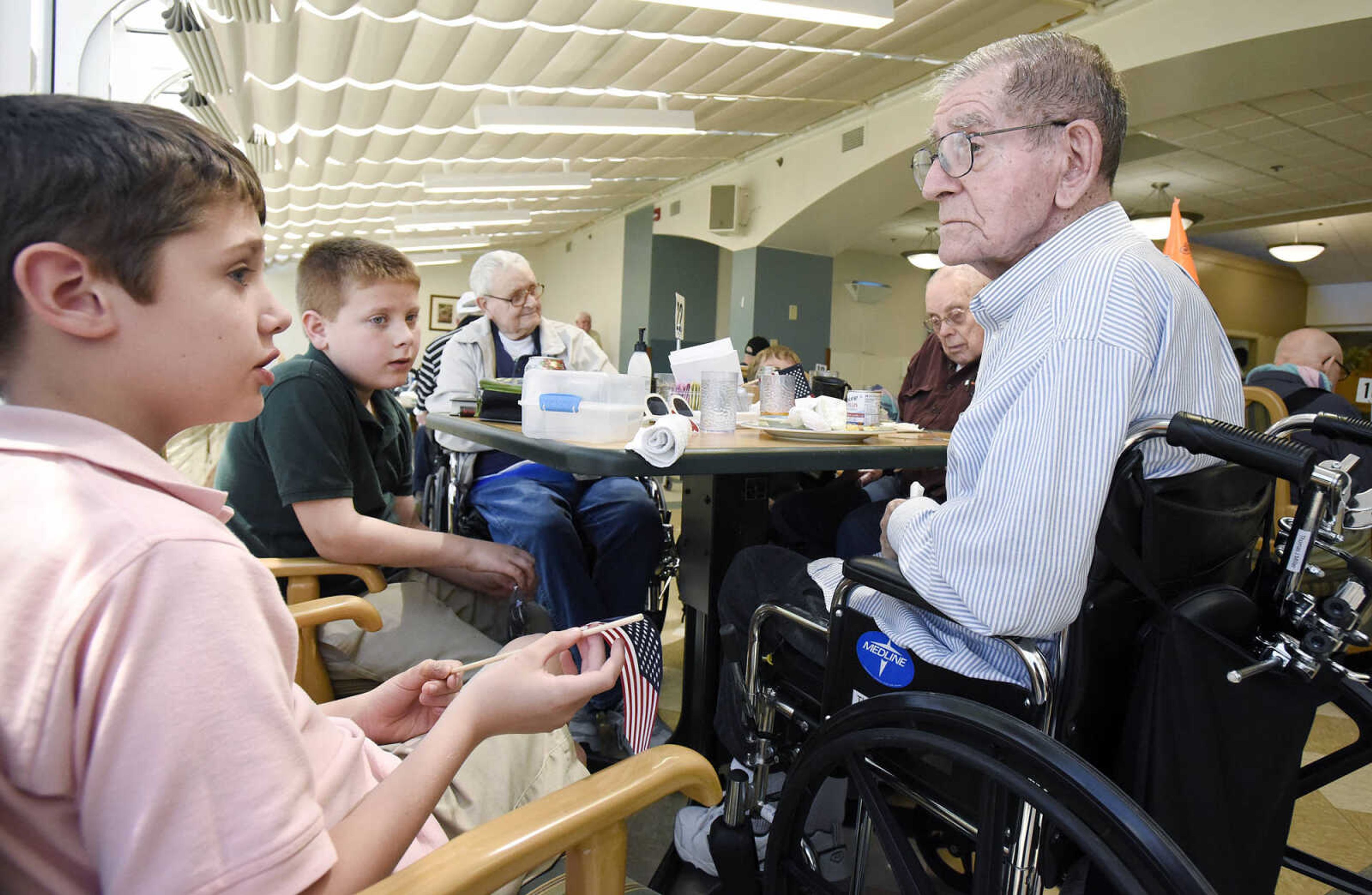 From left to right, Lueck Zimmerman, Timothy Vails, Don Yount, Bill Matthews and Thomas Miller visit over lunch on Tuesday, April 25, 2017, at the Missouri Veterans Home in Cape Girardeau.