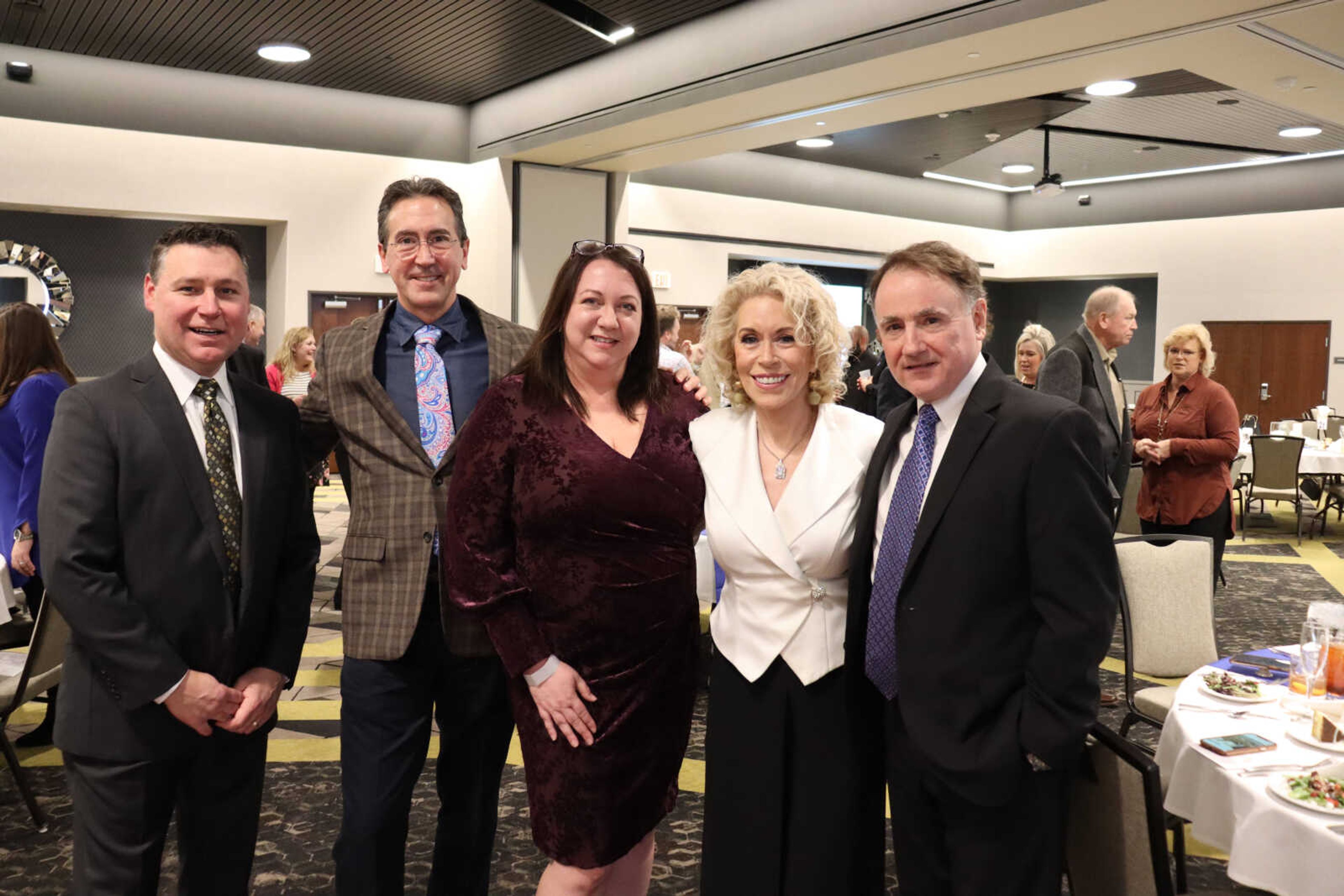 St. Francis sponsors (left to right) Stacy Puff, Gerry Salter, Requi Salter, Maryann Reese and Steve Bell smile for the camera.