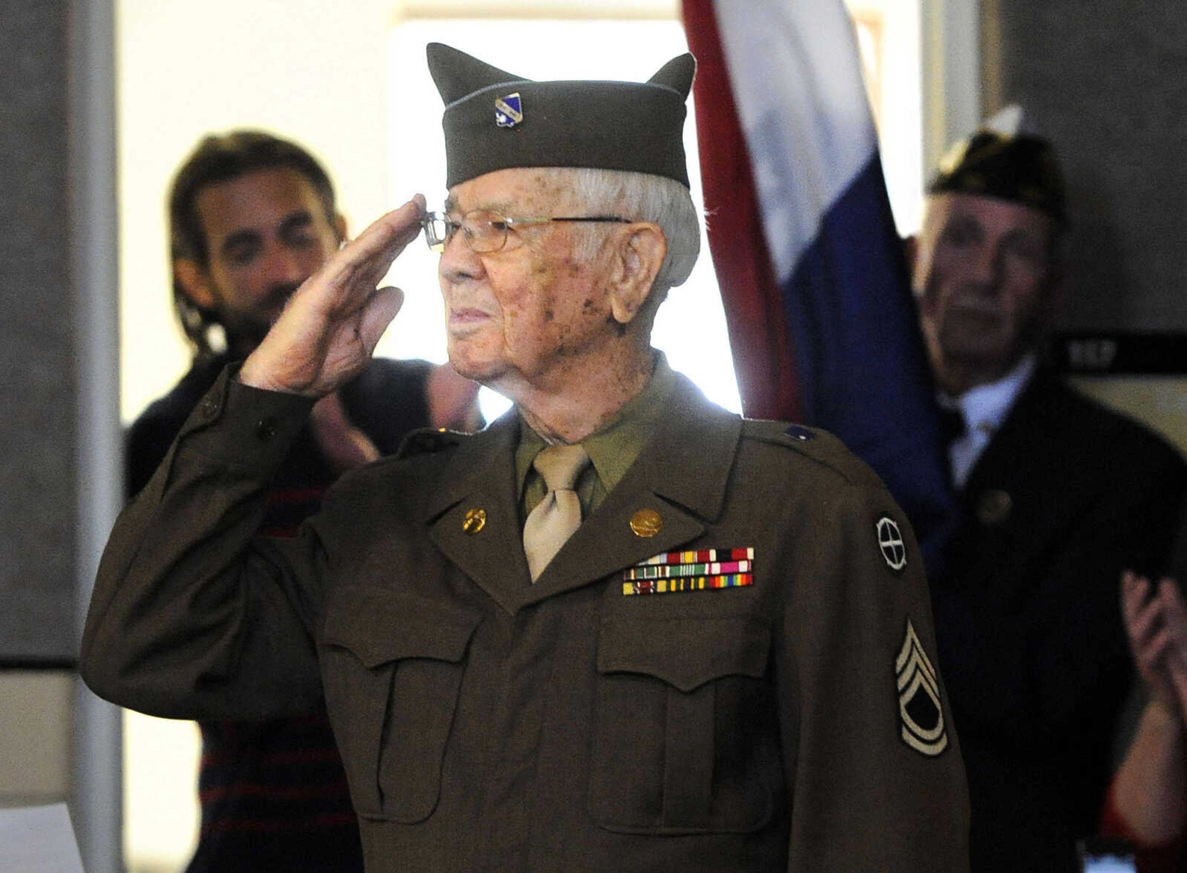 LAURA SIMON ~ lsimon@semissourian.com

Floyd Smith salutes the crowd on Monday, March 21, 2016, during the living history event honoring the WWII lost crew of the Flying Fortress 812, and the medal presentation to Sgt. Clifford Heinrich at Alma Schrader Elementary. Heinrich was presented with an American Campaign Medal, WWII Victory Medal, Army Good Conduct Medal, a WWII Lapel Button, European-African-Middle Eastern Campaign Medal and the Purple Heart for his service during WWII during Monday's presentation.