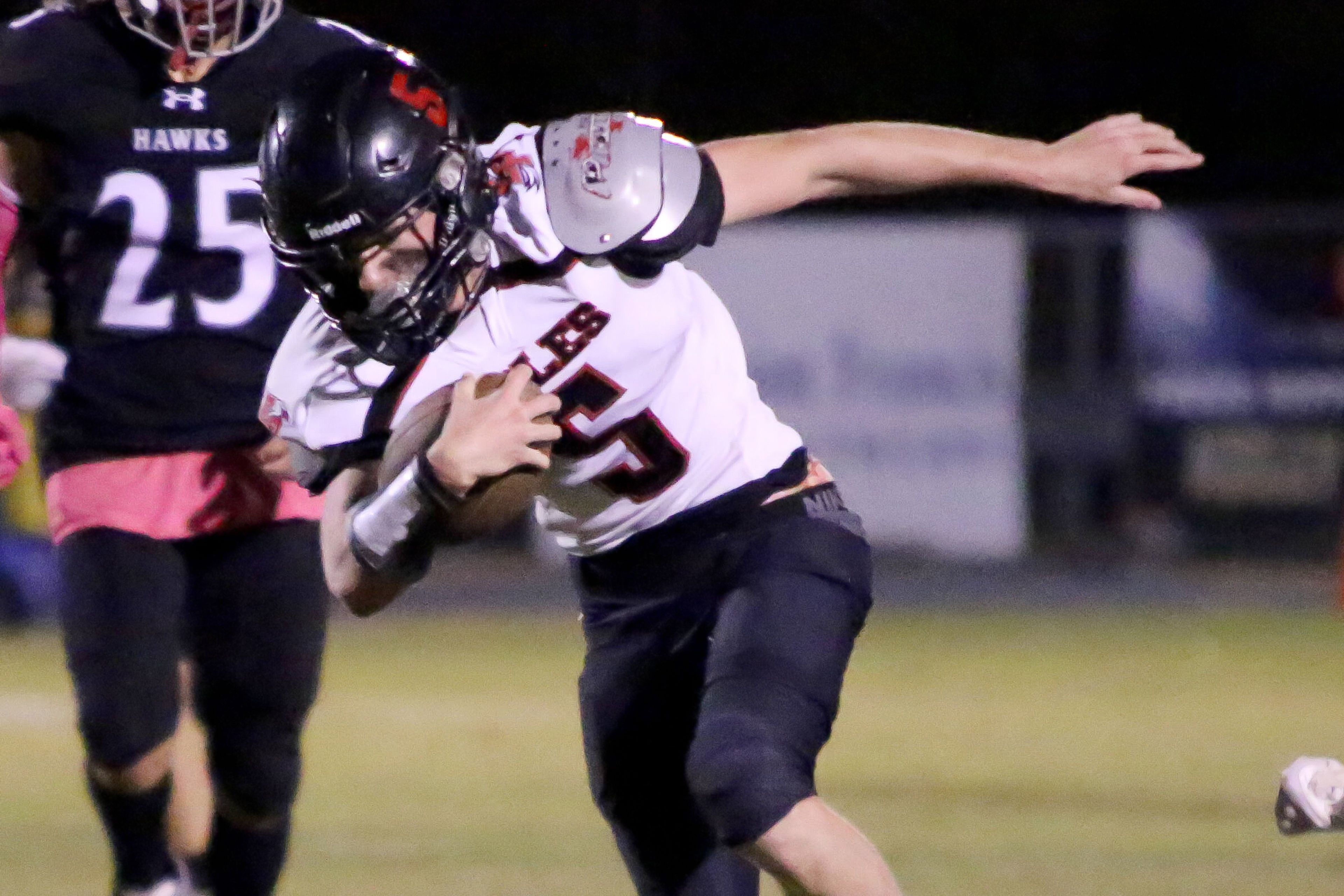 East Prairie’s Connor Marcum, right, keeps his balance during a game between the East Prairie Eagles and the Kelly Hawks on Friday, Oct. 11, in Benton.