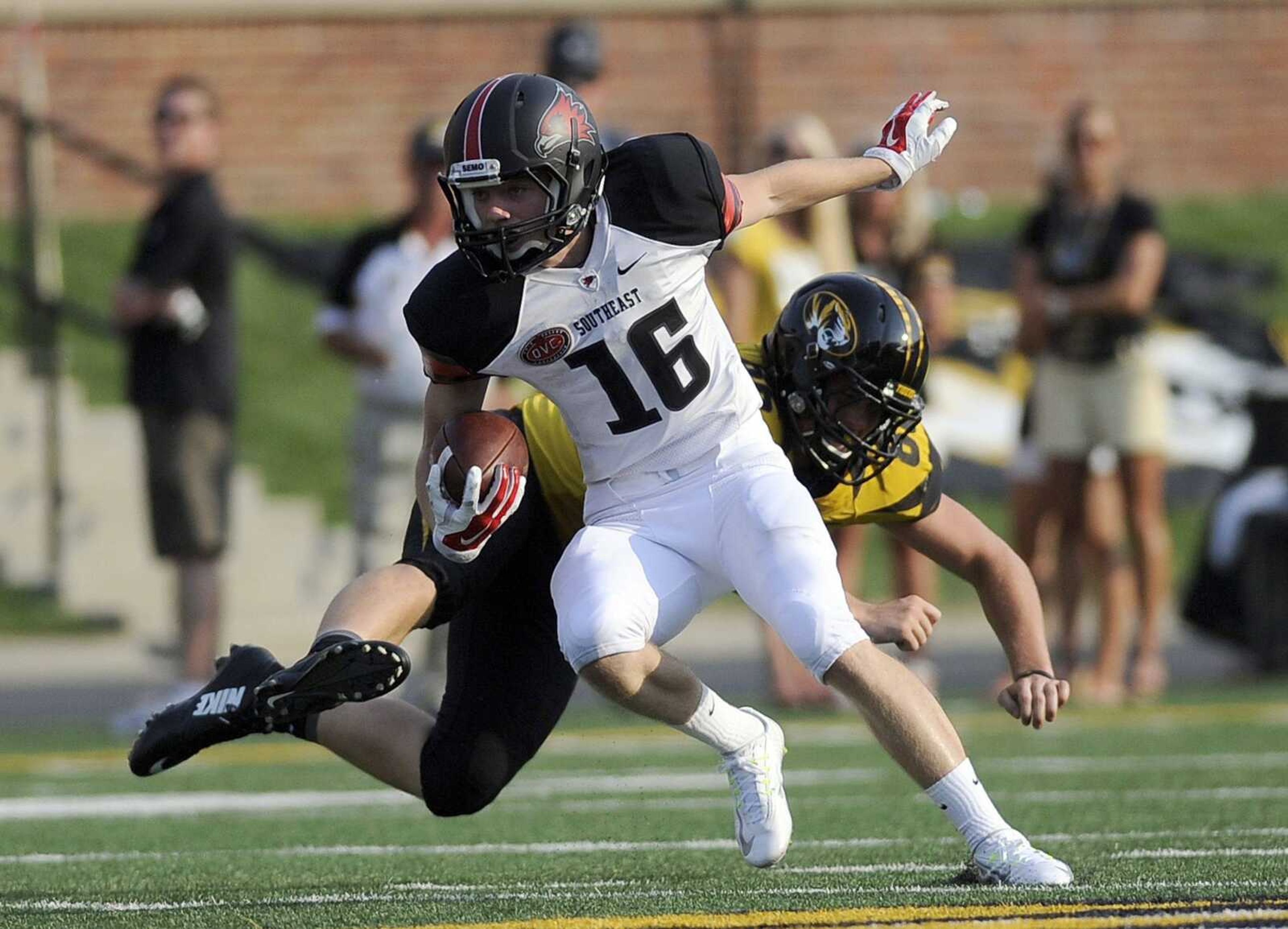 Southeast Missouri State's Tyler Manne shakes off a Missouri defender during last week's game at Faurot Field in Columbia, Missouri. (lsimon@semissourian.com)