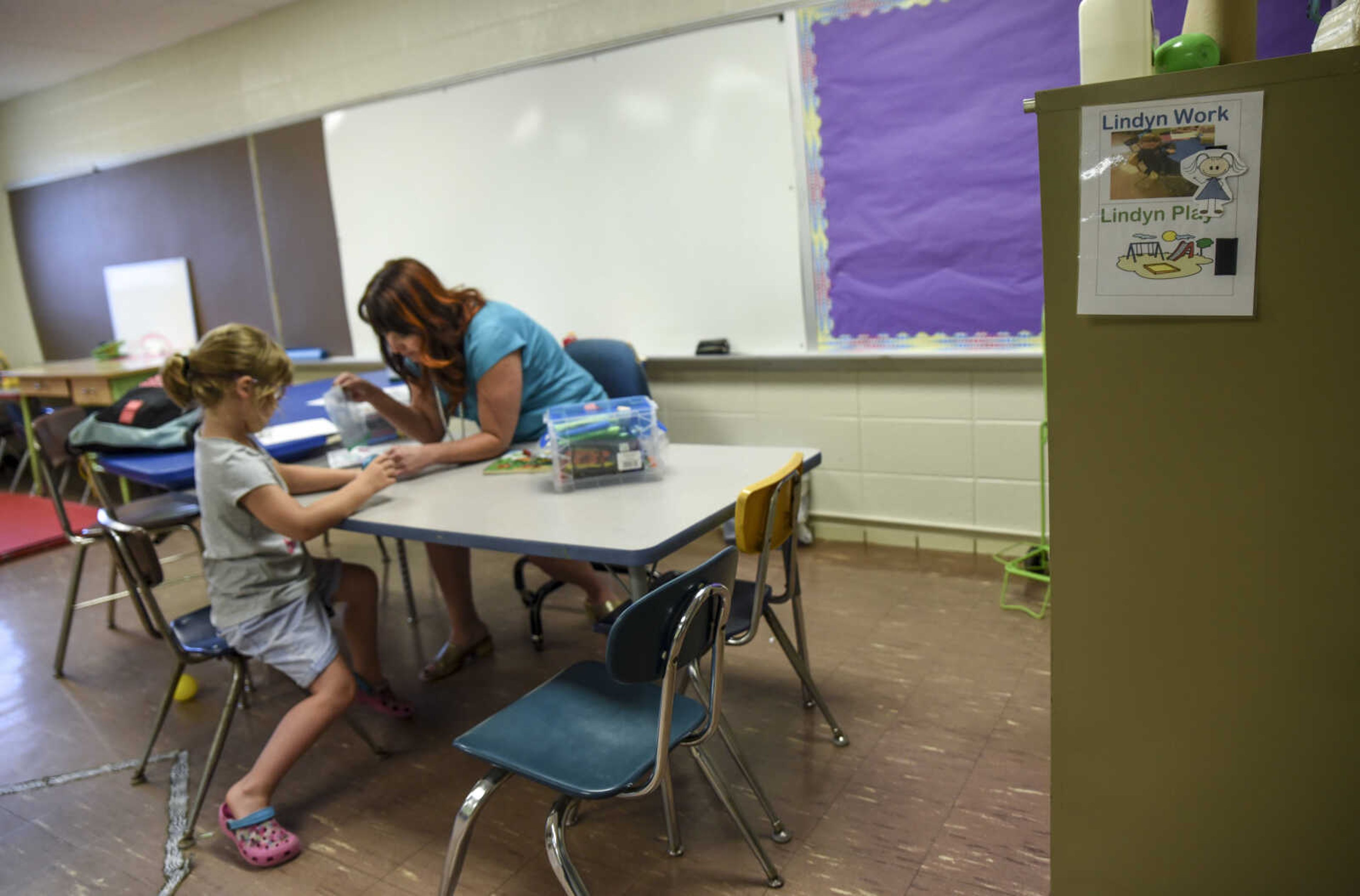 Lindyn Davenport, 6, works with Teresa Cobb, occupational therapist for Woodland school district, as part of her special services provided at Woodland Elementary School Tuesday, June 5, 2018 in Marble Hill.