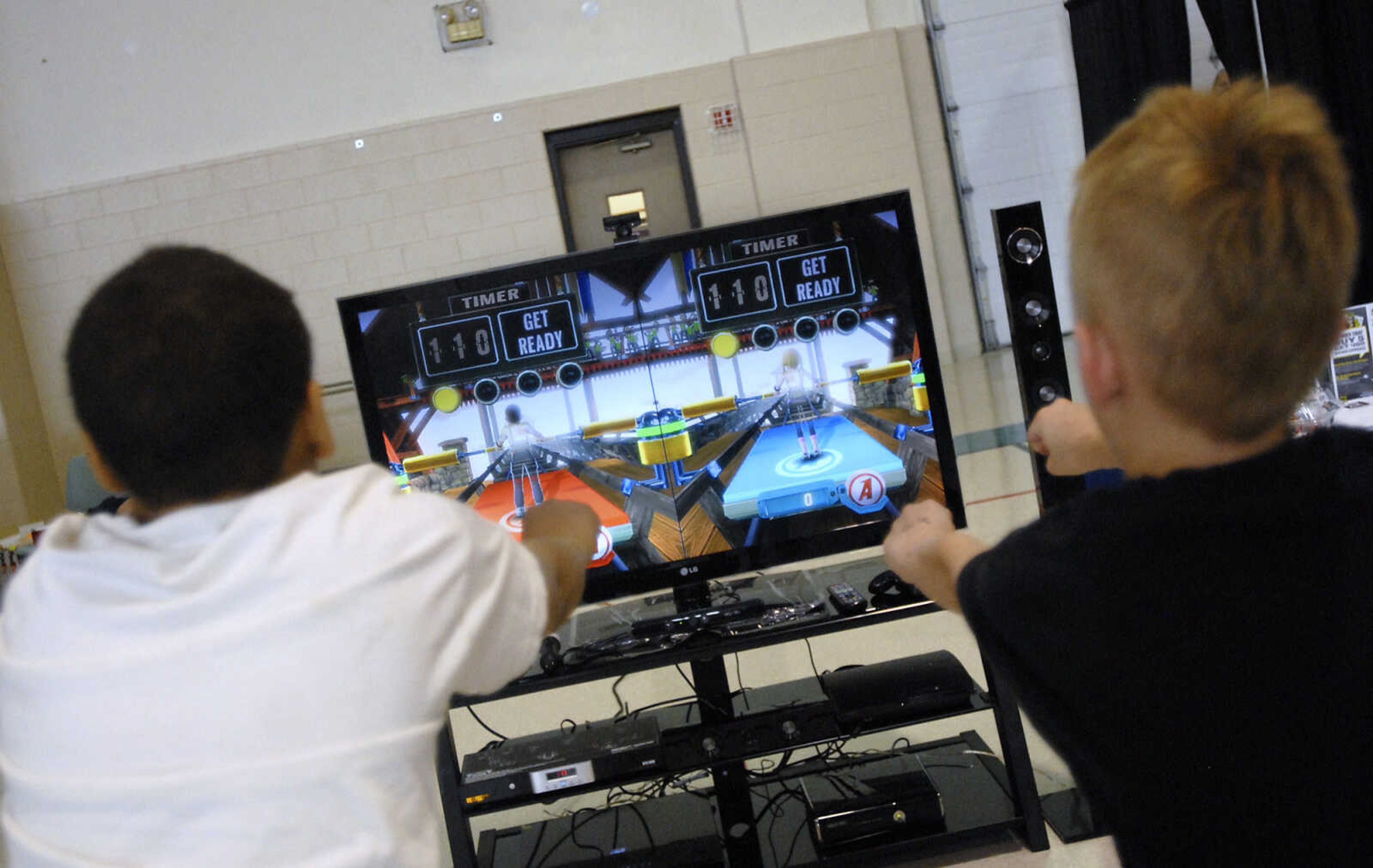 KRISTIN EBERTS ~ keberts@semissourian.com

Julian Rowles, 11, left, and Dominic Bellis, 9, right, play Kinect Adventures on Xbox during the sixth annual Cape Comic Con on Saturday, June 25, 2011, at the Osage Centre in Cape Girardeau.