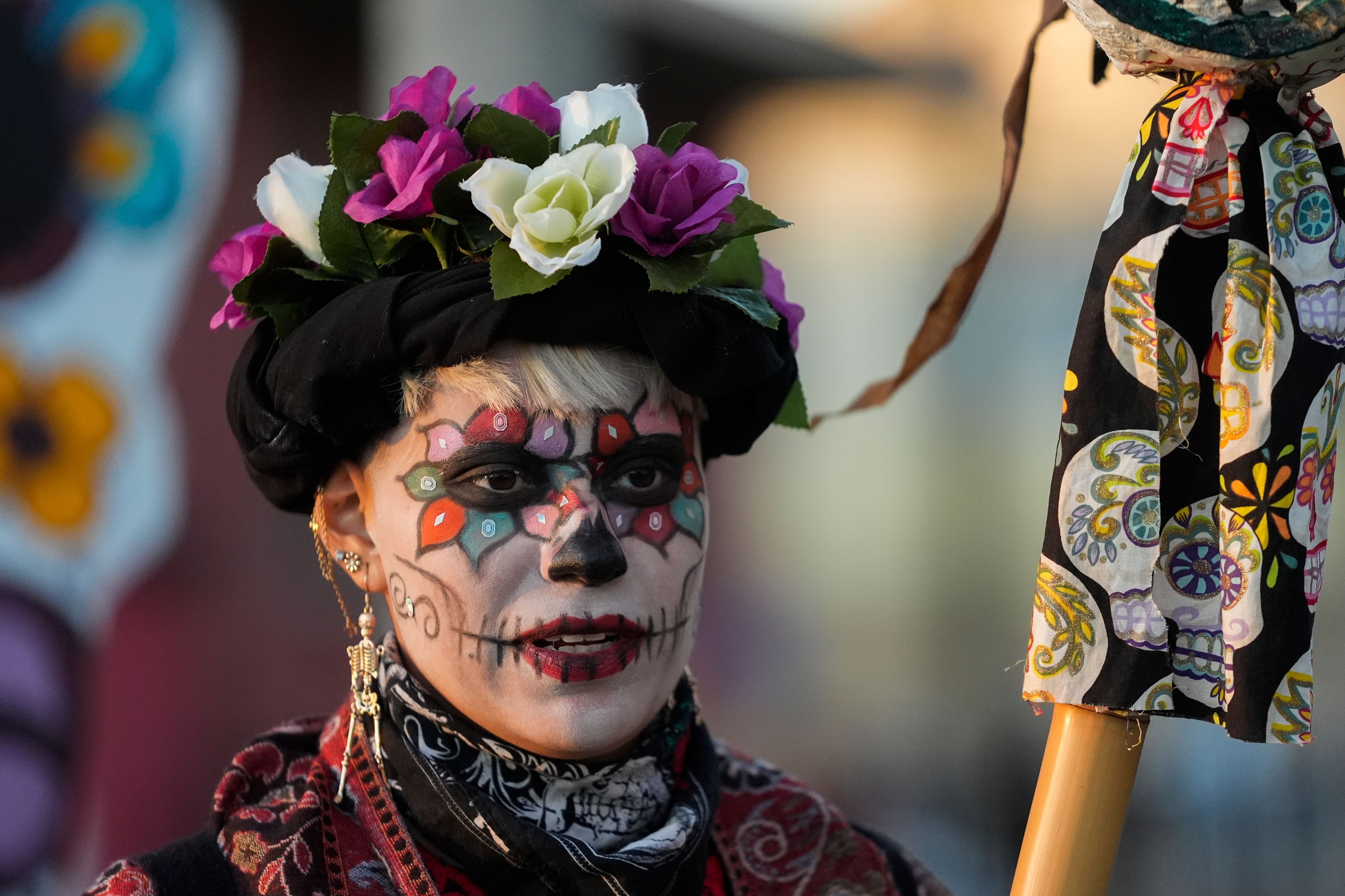 Marnee Ostoa Garciam 29, walks in a Day of the Dead procession, Friday, Nov. 1, 2024, in the Pilsen neighborhood of Chicago. (AP Photo/Erin Hooley)