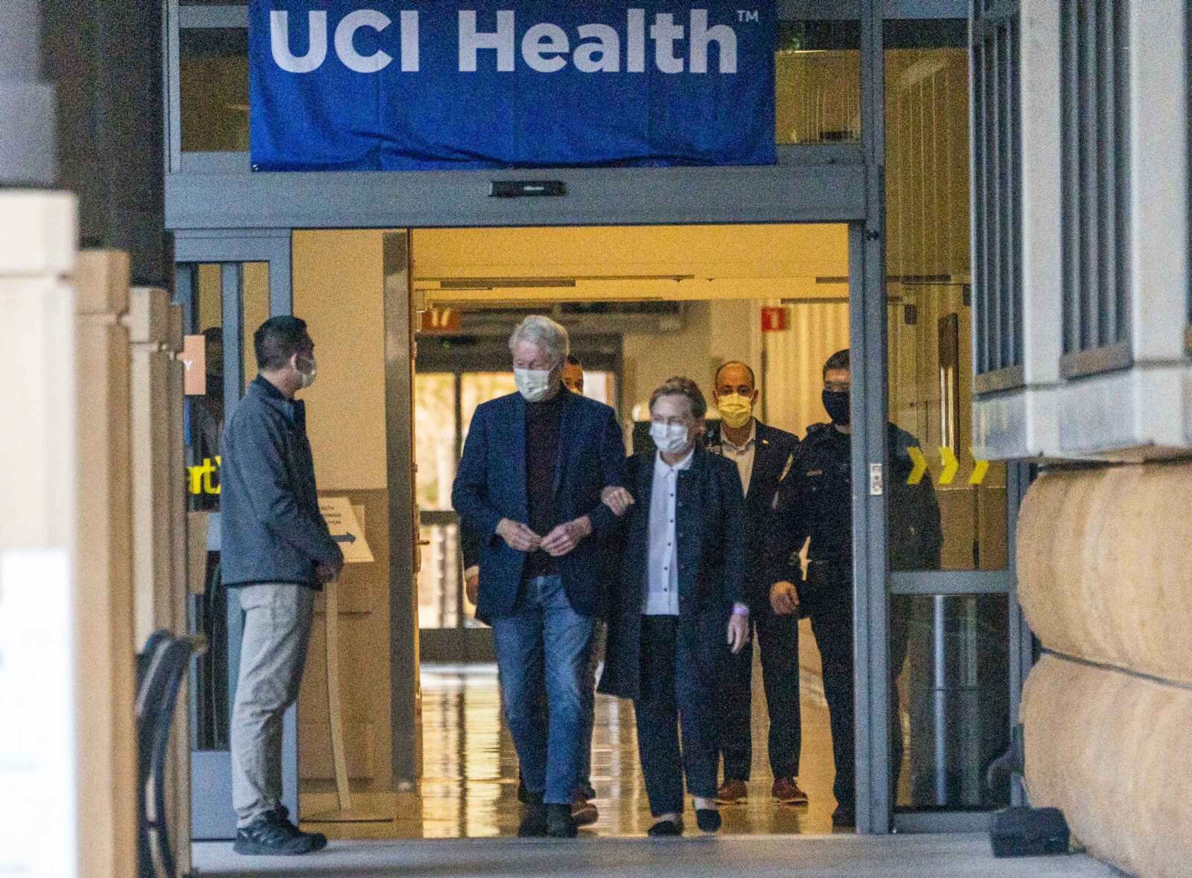 Former President Bill Clinton and former U.S. Secretary of State Hillary Clinton leave the University of California Irvine Medical Center on Sunday in Orange, California. He was released after being treated for an infection and will head home to New York to continue his recovery, a spokesman said.