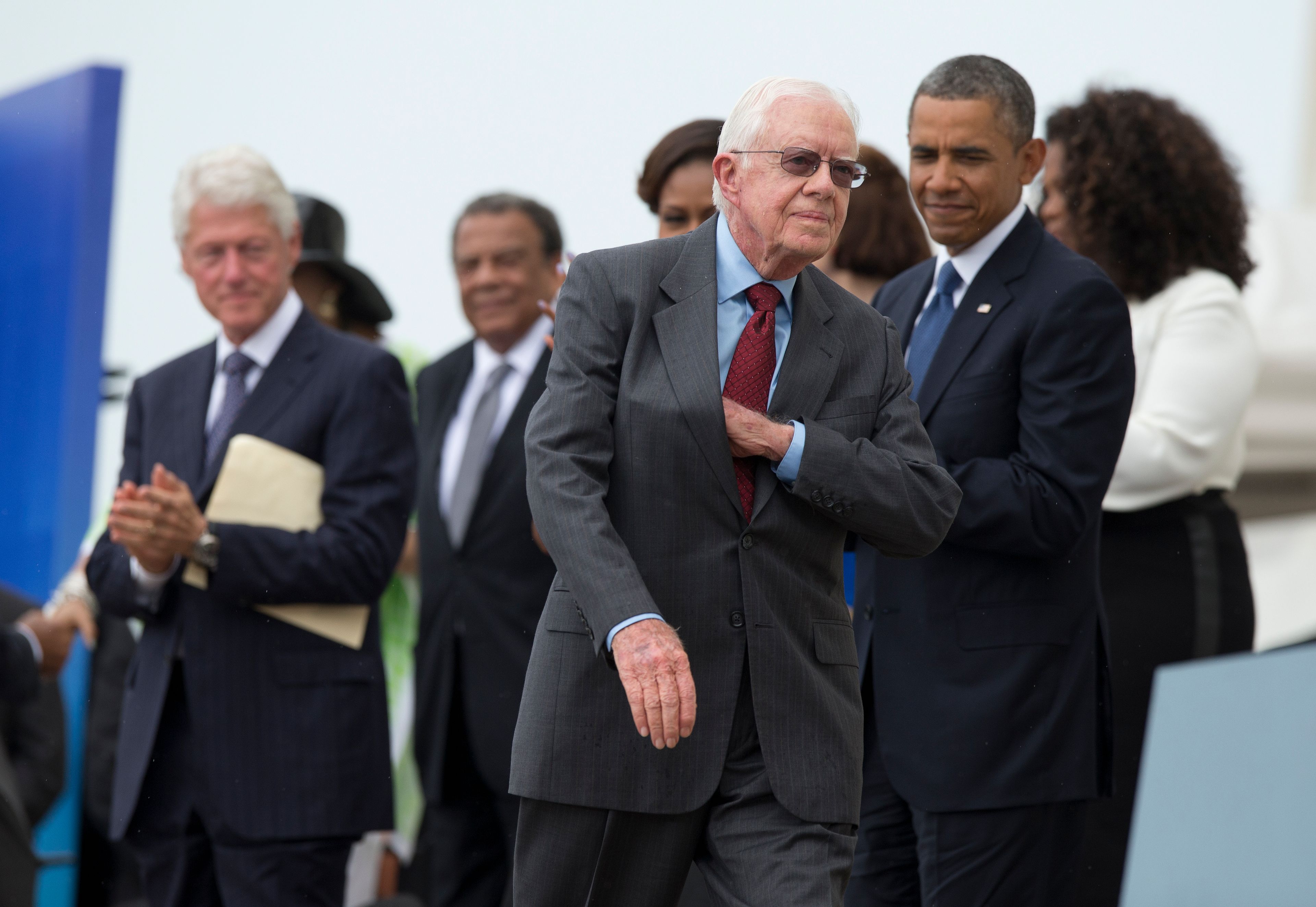 FILE - Former President Jimmy Carter pulls notes out of his pocket before delivering remarks during a ceremony commemorating the 50th anniversary of the March on Washington at the Lincoln Memorial in Washington, Aug. 28, 2013. (AP Photo/Evan Vucci, File)