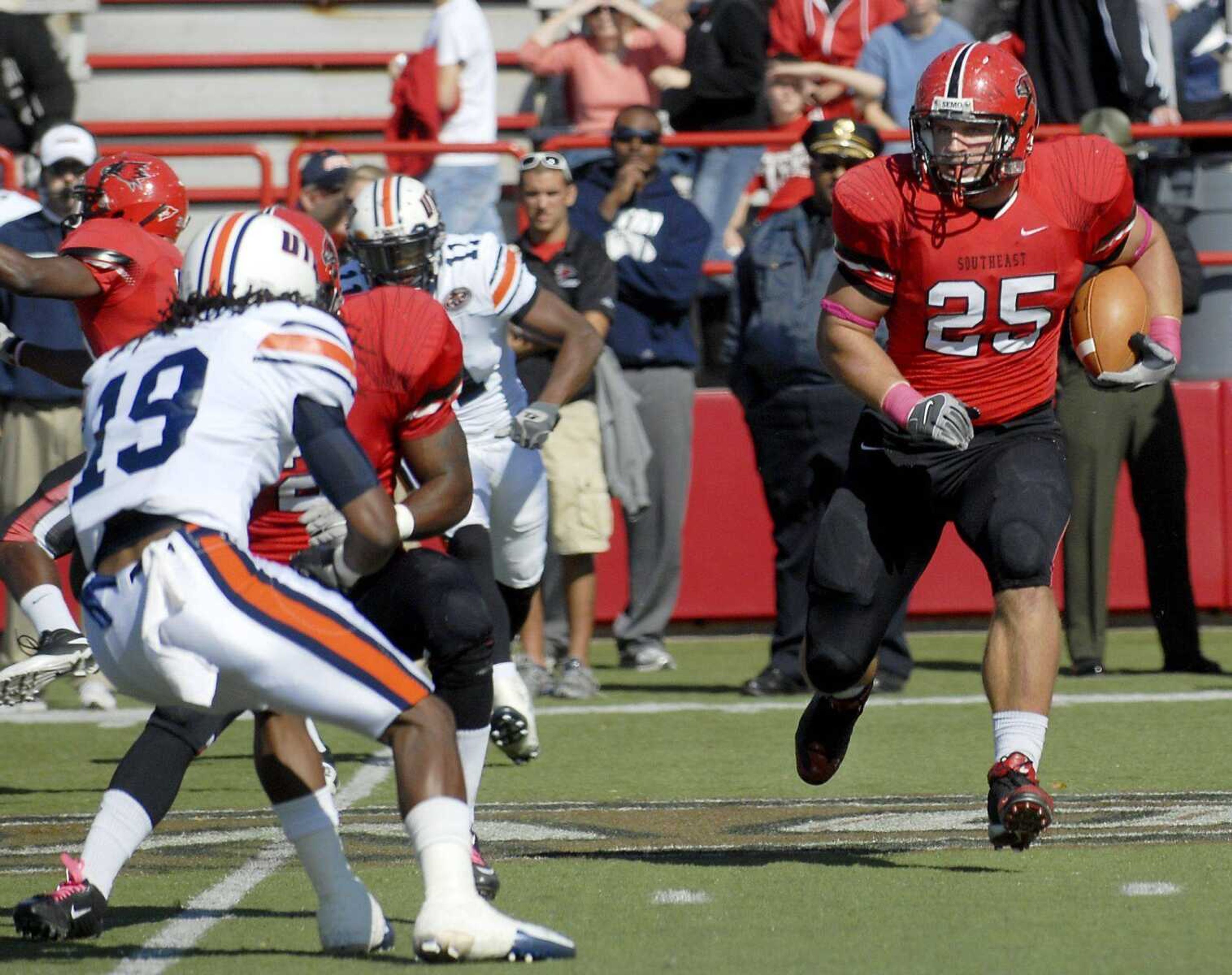 Southeast Missouri State University's Nathan Grass runs the ball as Tennessee-Martin's Runako Brown pushes toward him during the first quarter of a Homecoming game on Saturday, Oct. 30, 2010, at Houck Stadium. SEMO won 24-17. (Kristin Eberts)