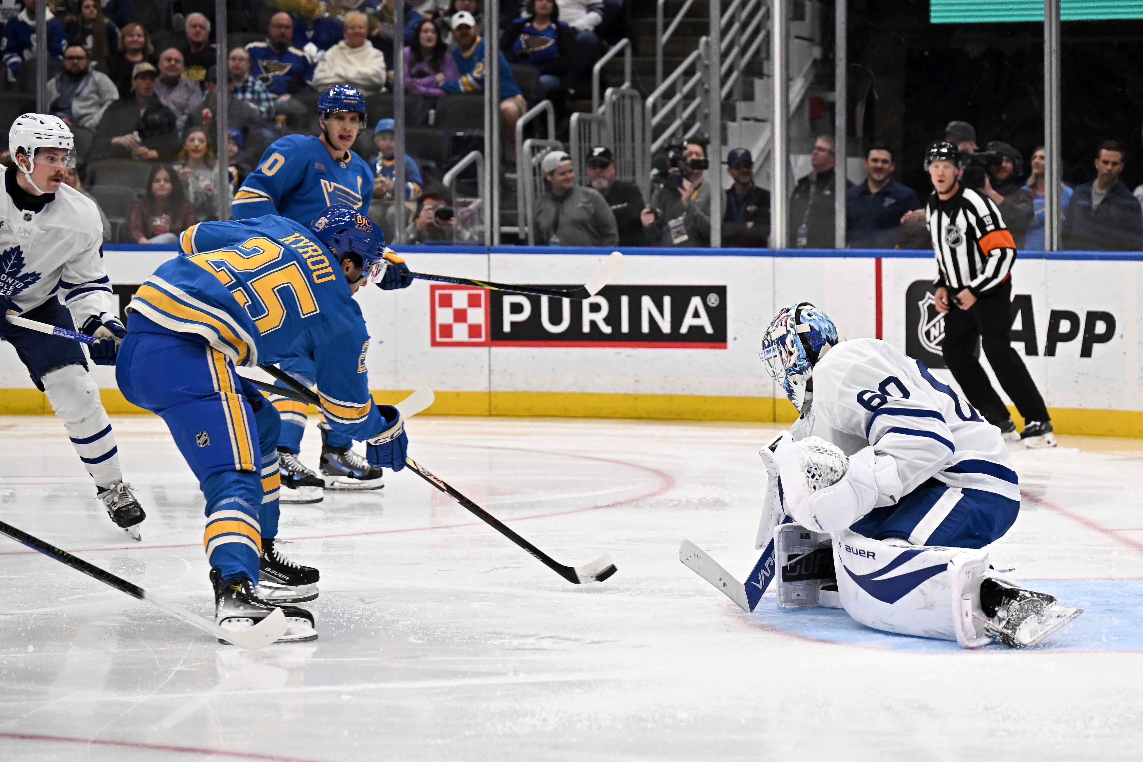 Toronto Maple Leafs' goaltender Joseph Woll (60) defends as St. Louis Blues' Jordan Kyrou (25) shoots during the second period of an NHL hockey game Saturday, Nov. 2, 2024, in St. Louis. (AP Photo/Connor Hamilton)