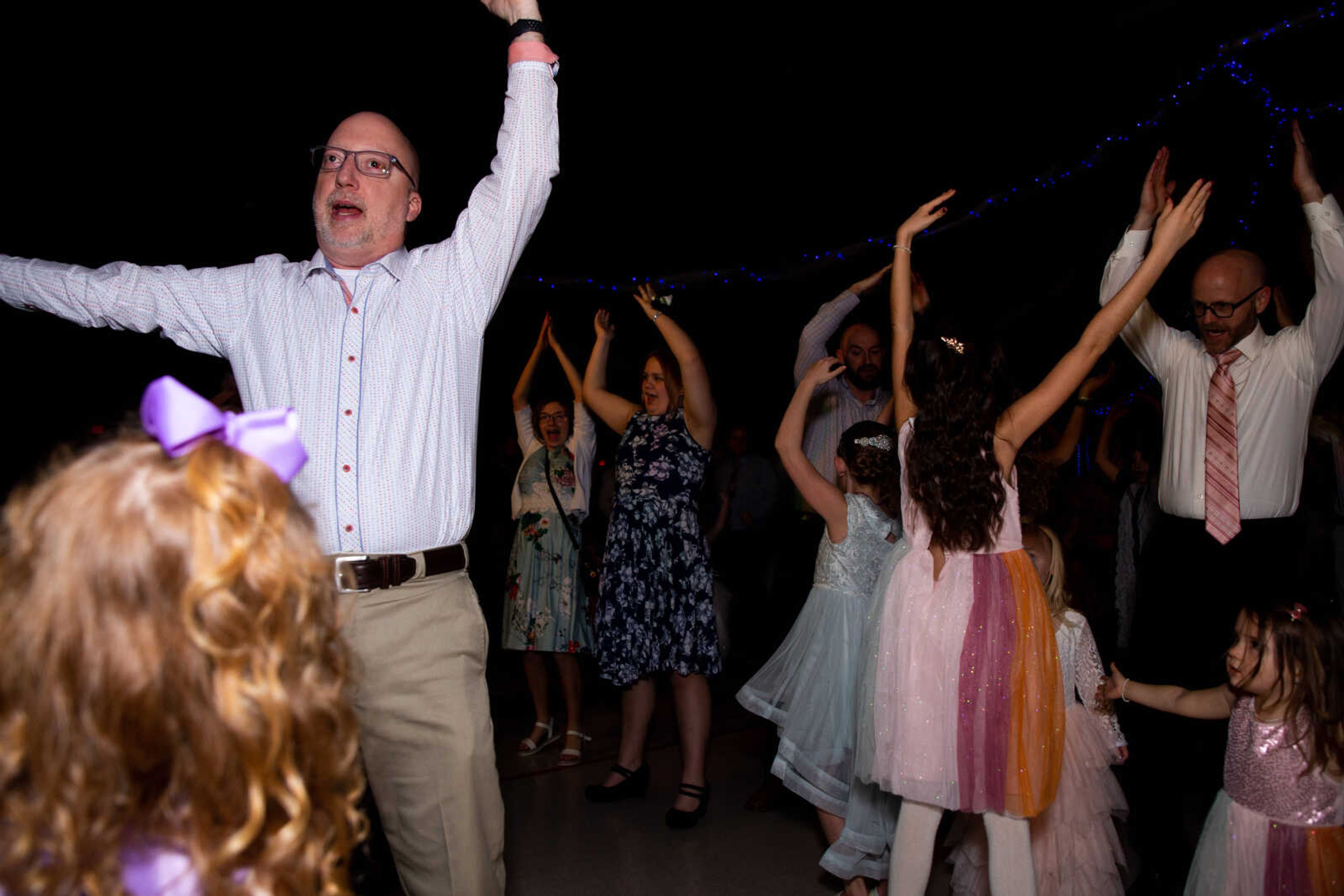 Greg Vaughn, left, dances with his daughter Whitley Vaughn, 4.