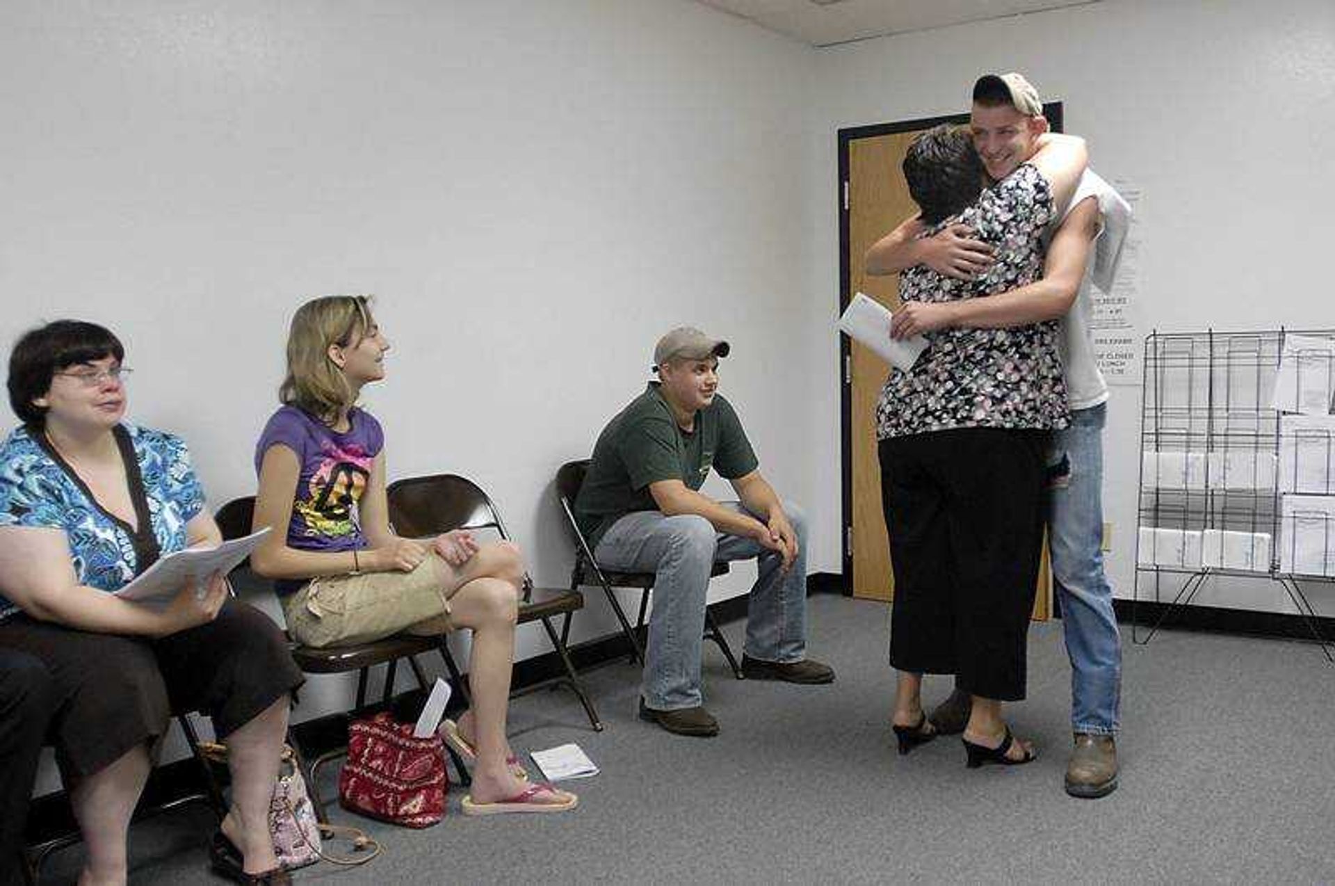 KIT DOYLE ~ kdoyle@semissourian.com
Justin Eddleman got a hug from Pam Deneke for passing the driver's permit test Thursday on his seventh attempt.