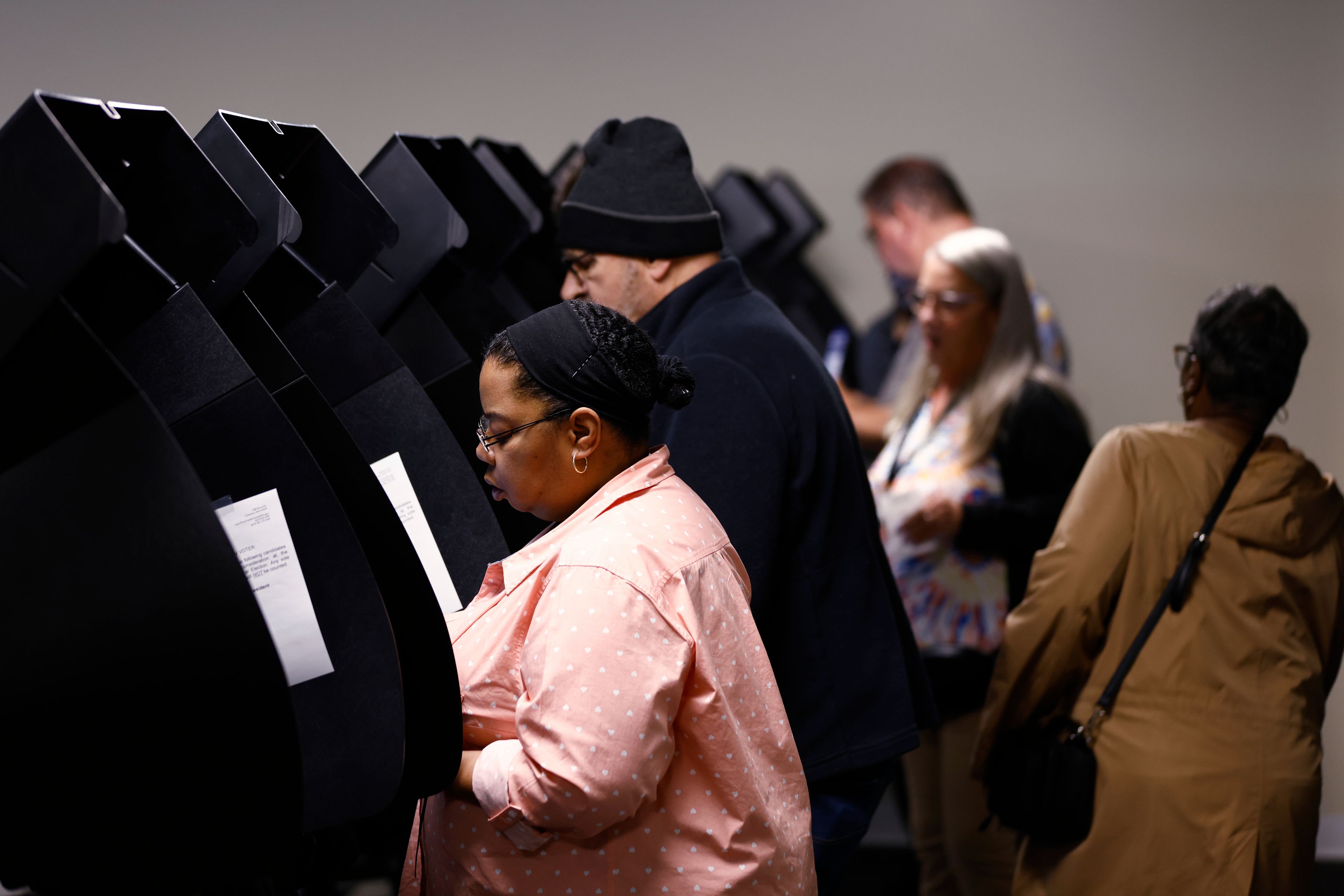 Voters cast their ballots during the first day of in person early voting at the Franklin County Board of Elections in Columbus, Ohio, Tuesday, Oct. 8, 2024. (AP Photo/Paul Vernon)