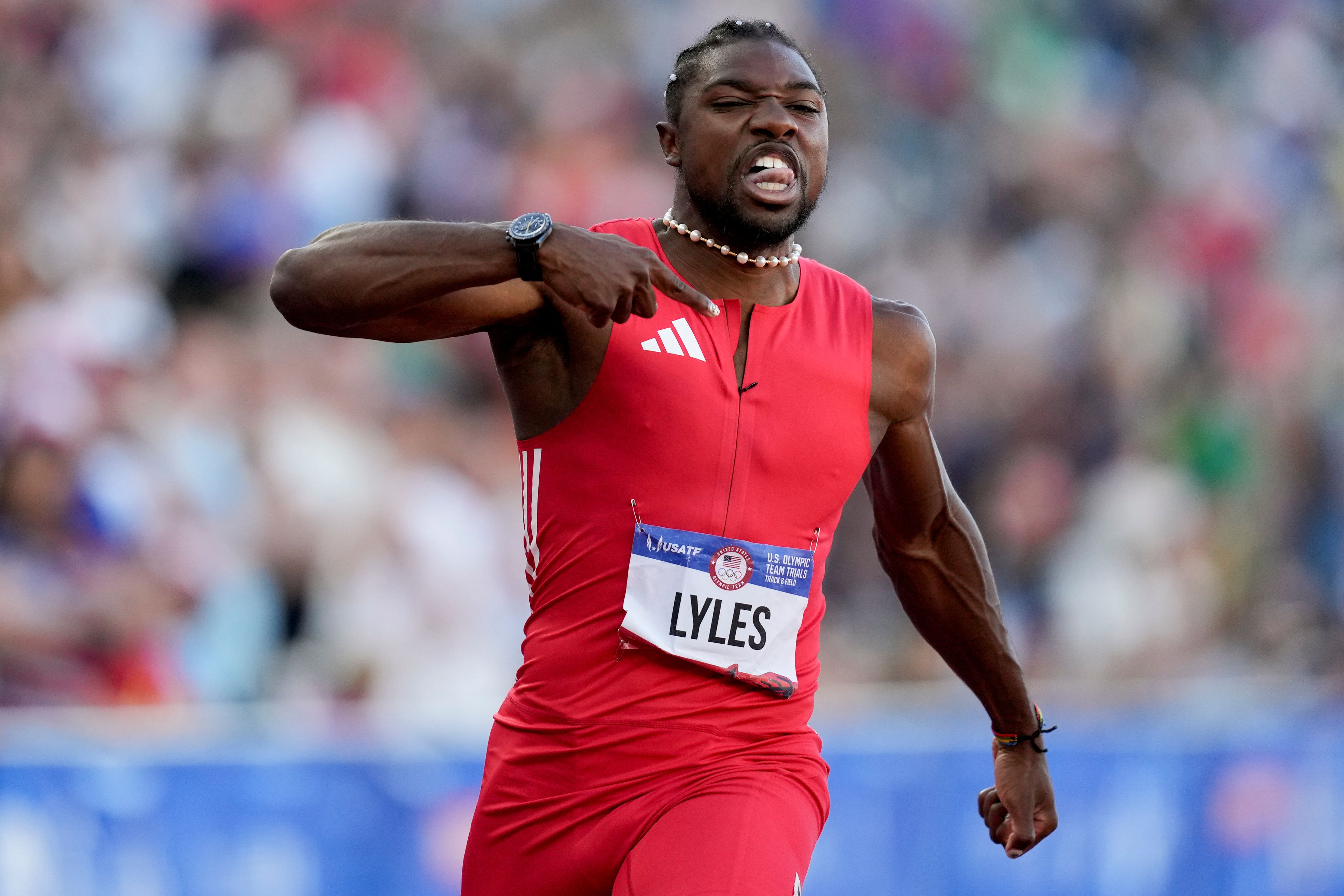 FILE - Noah Lyles celebrates after winning the men's 100-meter final during the U.S. Track and Field Olympic Team Trials, June 23, 2024, in Eugene, Ore. (AP Photo/Charlie Neibergall, File)