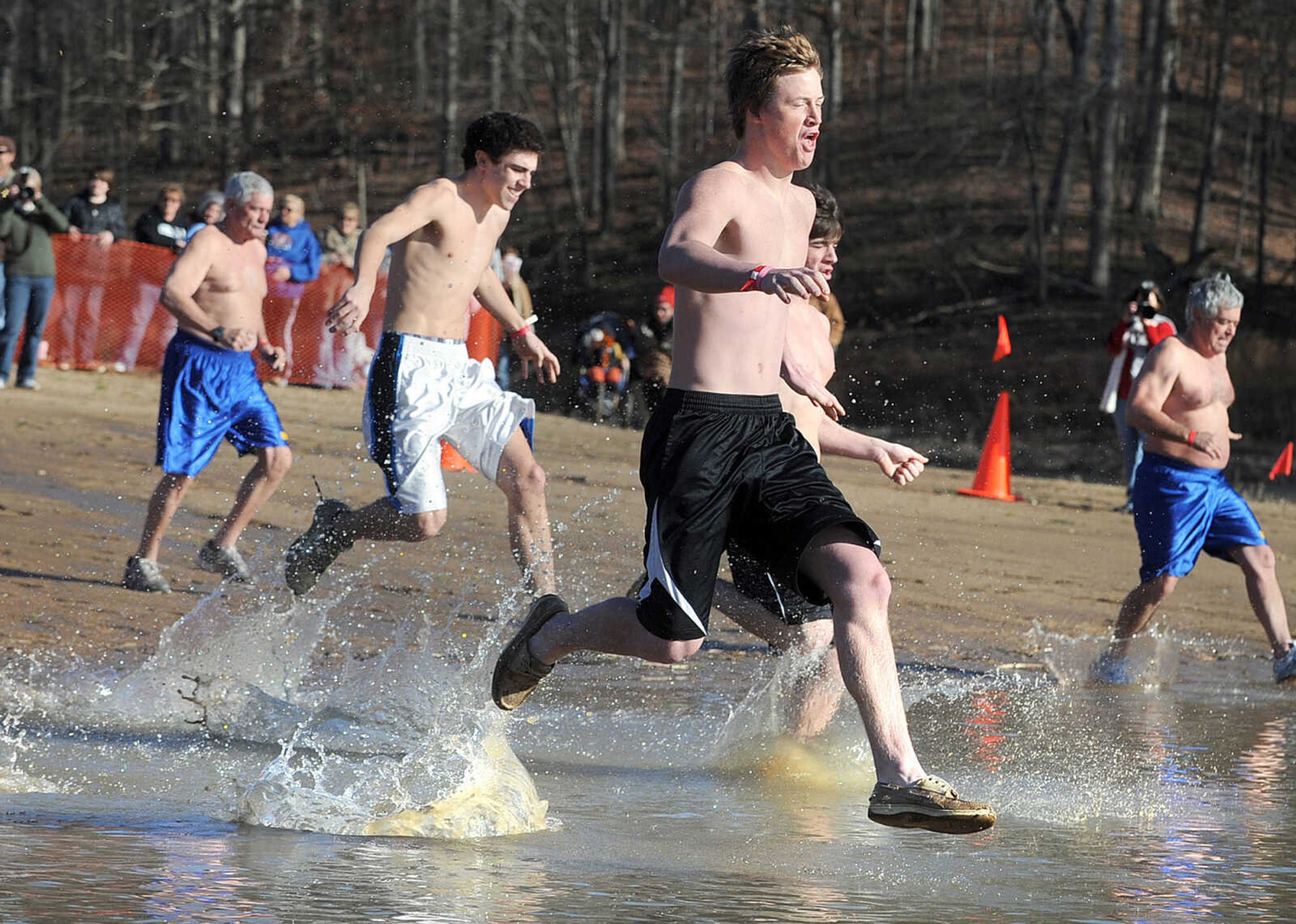 LAURA SIMON ~ lsimon@semissourian.com
People plunge into the cold waters of Lake Boutin Saturday afternoon, Feb. 2, 2013 during the Polar Plunge at Trail of Tears State Park. Thirty-six teams totaling 291 people took the annual plunge that benefits Special Olympics Missouri.