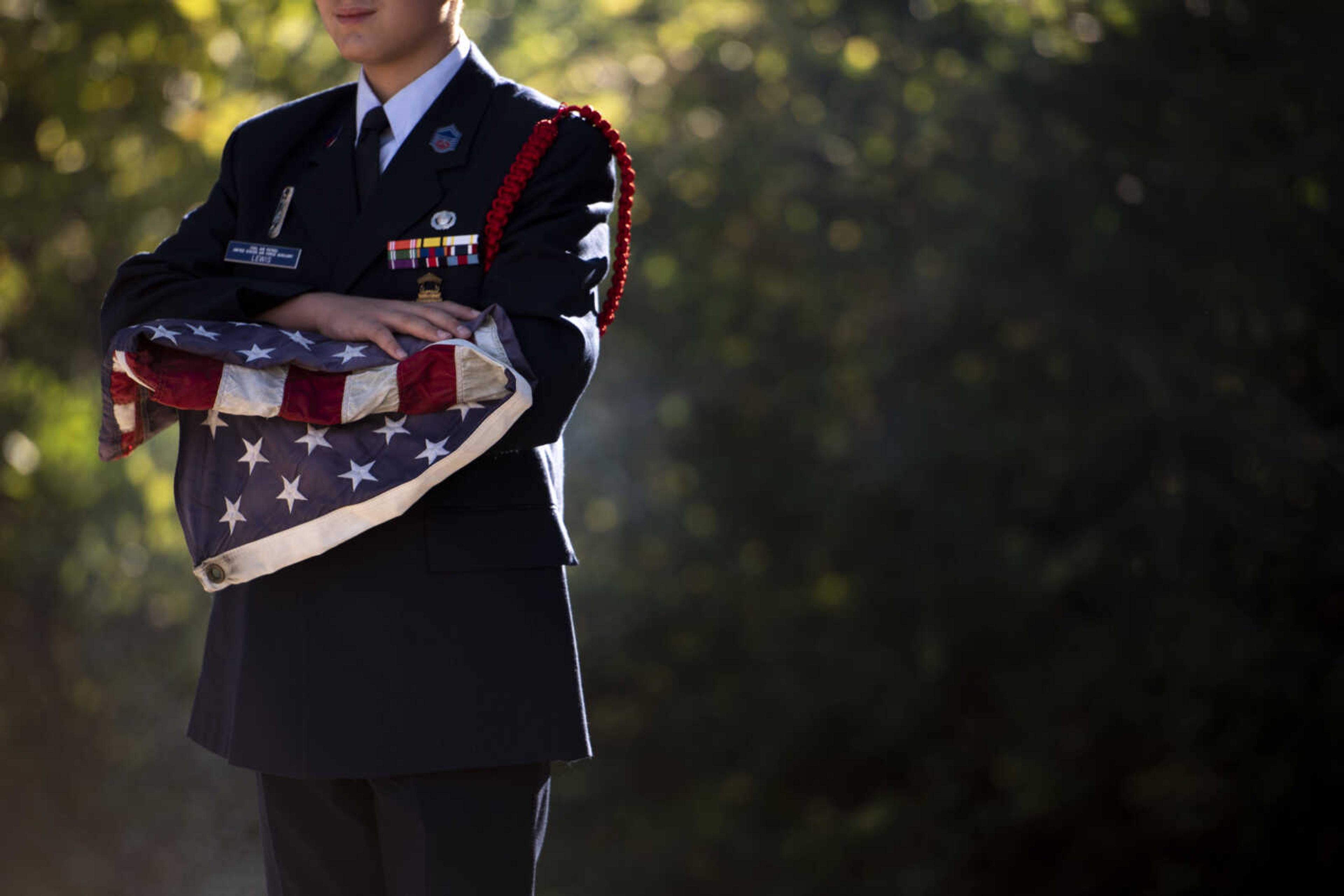 Cadet Chief Master Sergeant Gabriel Lewis holds an American flag to be retired during the inaugural flag retirement ceremony at VFW Post 3838 Sunday, Oct. 21, 2018, in Cape Girardeau.