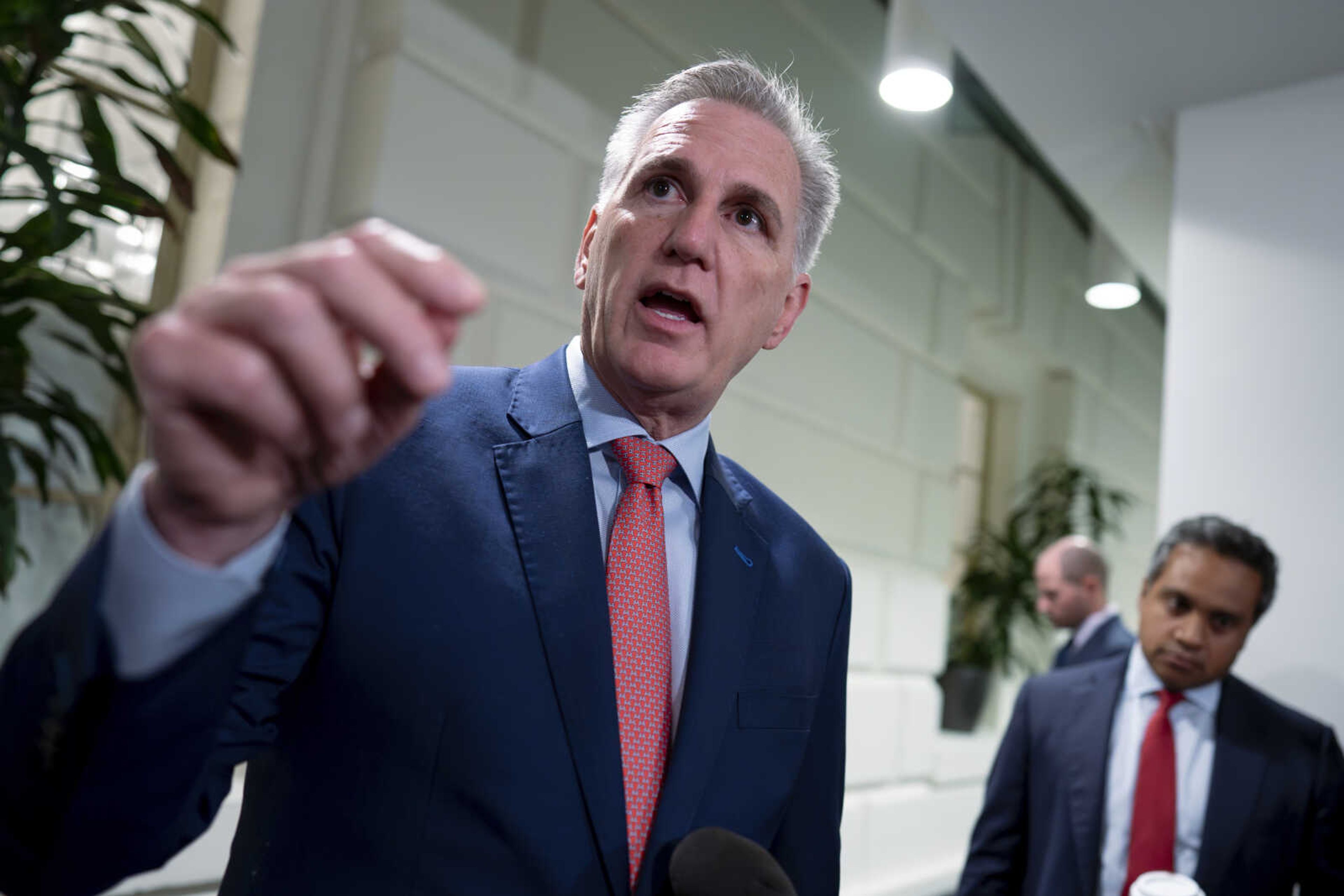 Speaker of the House Kevin McCarthy, R-Calif., talks to reporters about updates on funding the government and averting a shutdown, Wednesday at the Capitol in Washington.