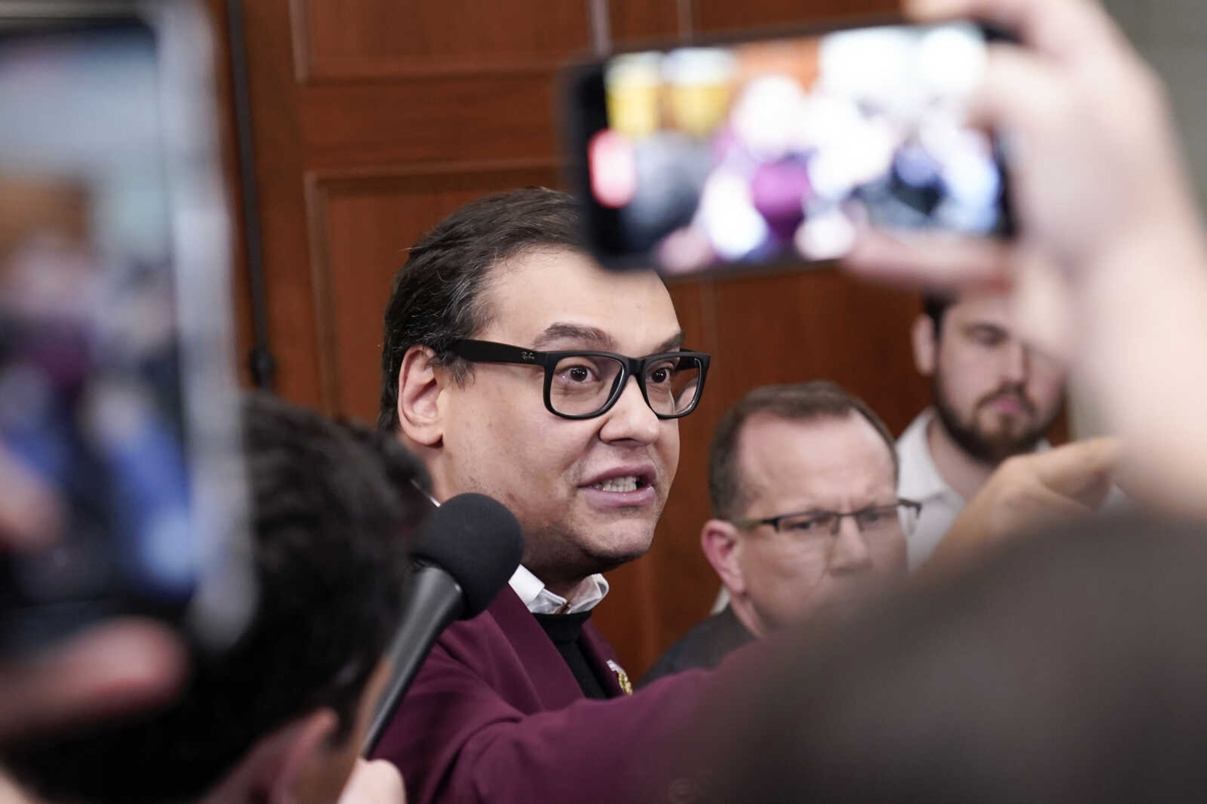 Rep. George Santos, R-N.Y., talks to reporters as House Republicans hold a caucus meeting Oct. 13 at the Capitol in Washington. Santos has said he expected to be expelled from Congress following a report by the House Ethics Committee that found substantial evidence of lawbreaking by the New York Republican. The comments on Friday, Nov. 24, came during a three-hour conversation on X Spaces in which Santos lashed out at colleagues and described the committee's report as "slanderous."