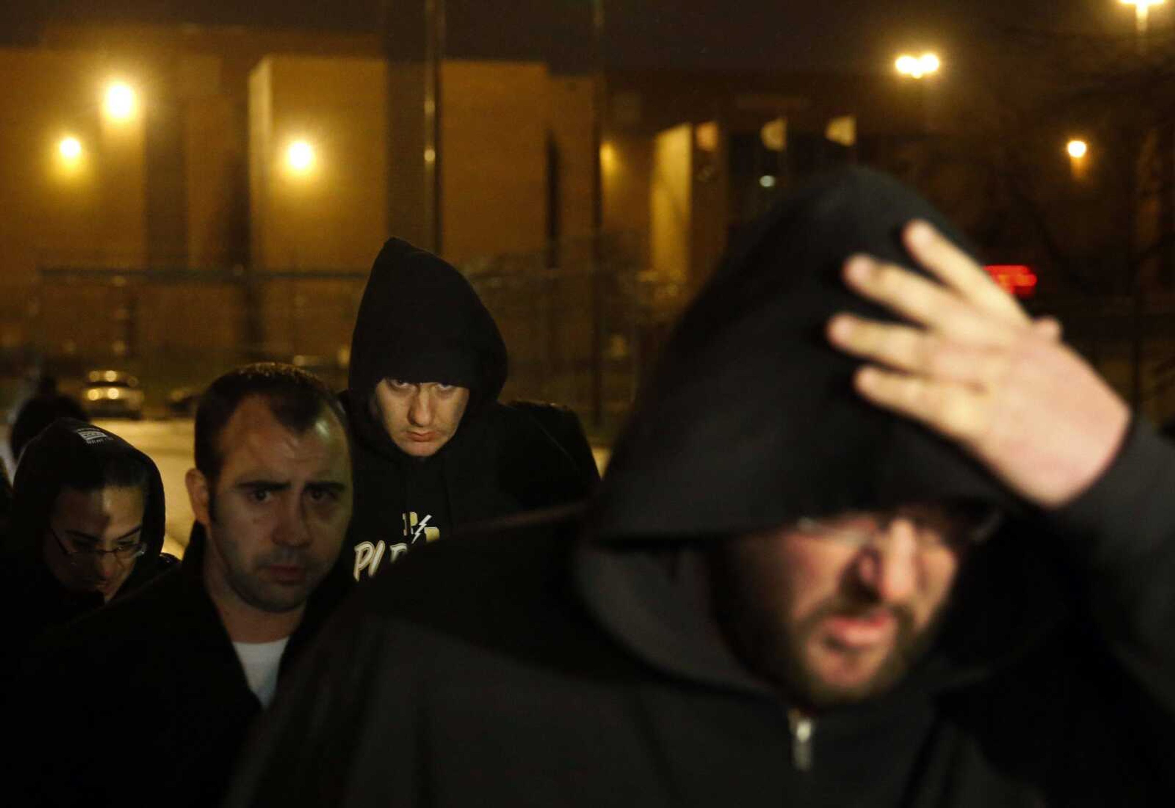 Chicago police officer Jason Van Dyke, background center, leaves the Cook County Jail after posting bond Monday in Chicago. (Charles Rex Arbogast ~ Associated Press)