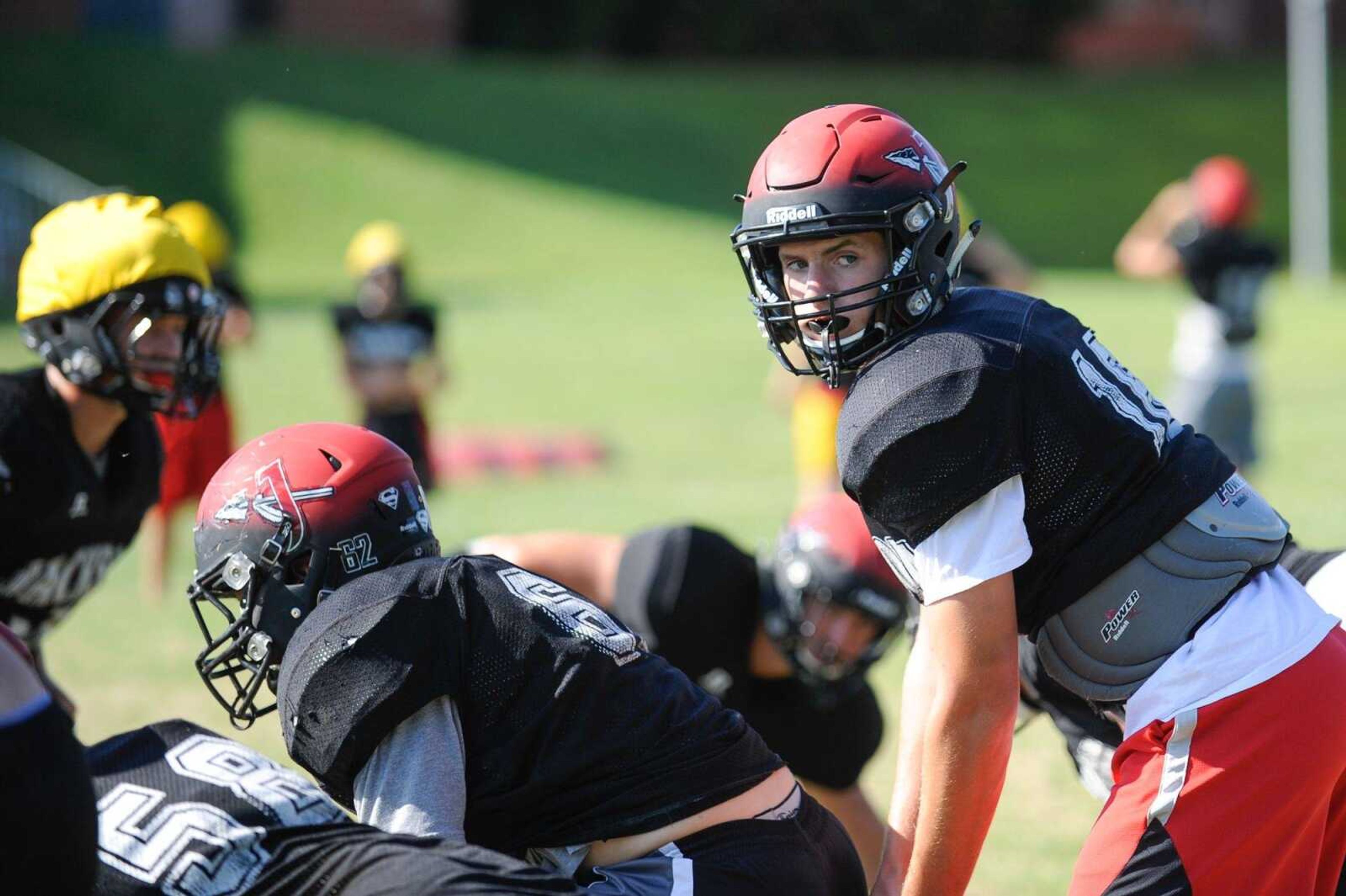 Jackson's Landry Moore waits to receive the snap during a drill in practice Tuesday, Aug. 11, 2015 at Jackson High School. (Glenn Landberg)