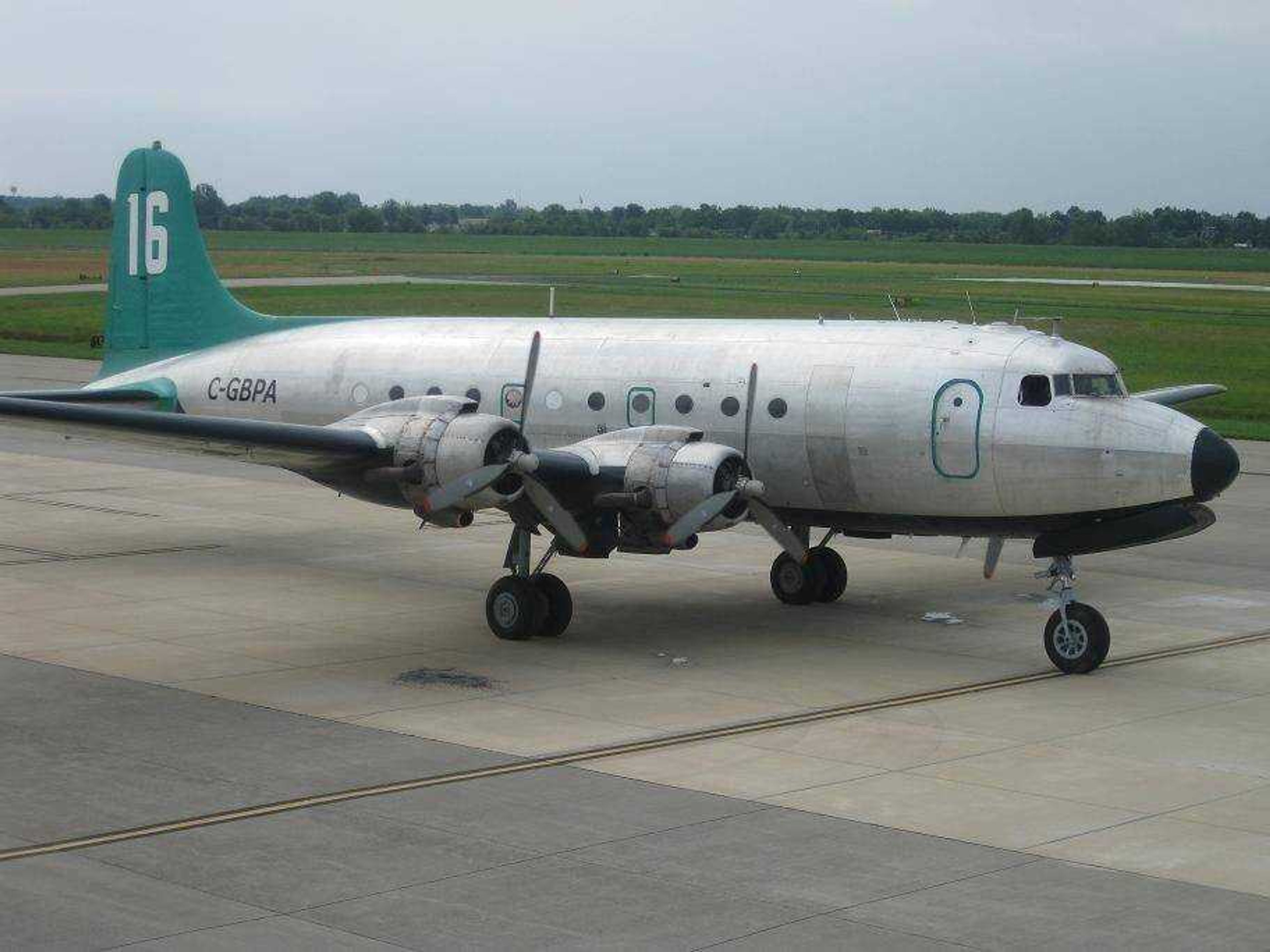 68 years-old, and still working.  This World War II DC-4 prepares to crank up and continue on it's journey to it's new base in Florida, where it will serve as an oil-dispersant spray plane.