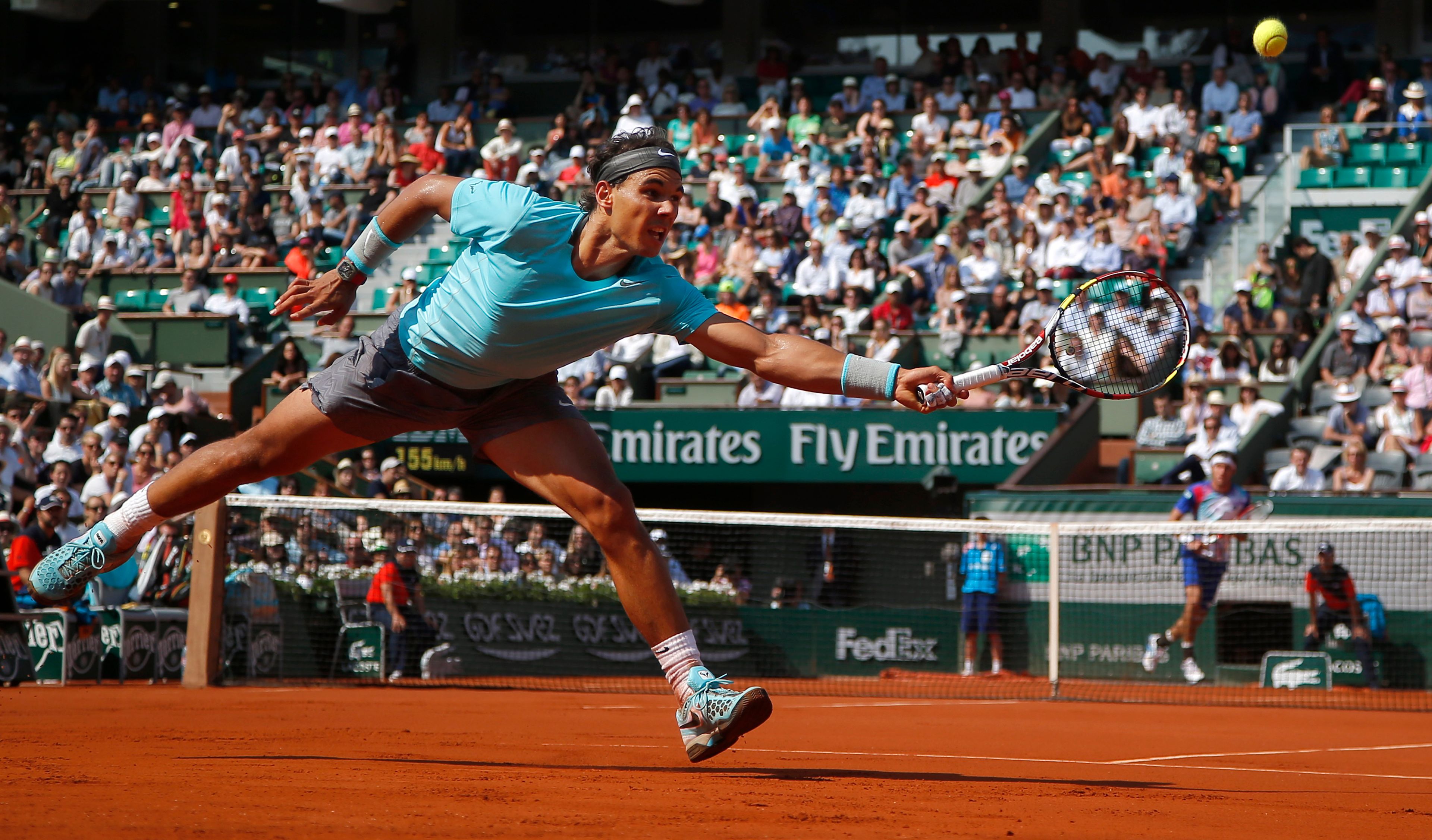 FILE - Spain's Rafael Nadal returns the ball during the third round match of the French Open tennis tournament against Argentina's Leonardo Mayer at the Roland Garros stadium, in Paris, France, Saturday, May 31, 2014, as he has announced he will retire from tennis at age 38 following the Davis Cup finals in November. (AP Photo/Michel Euler, File)