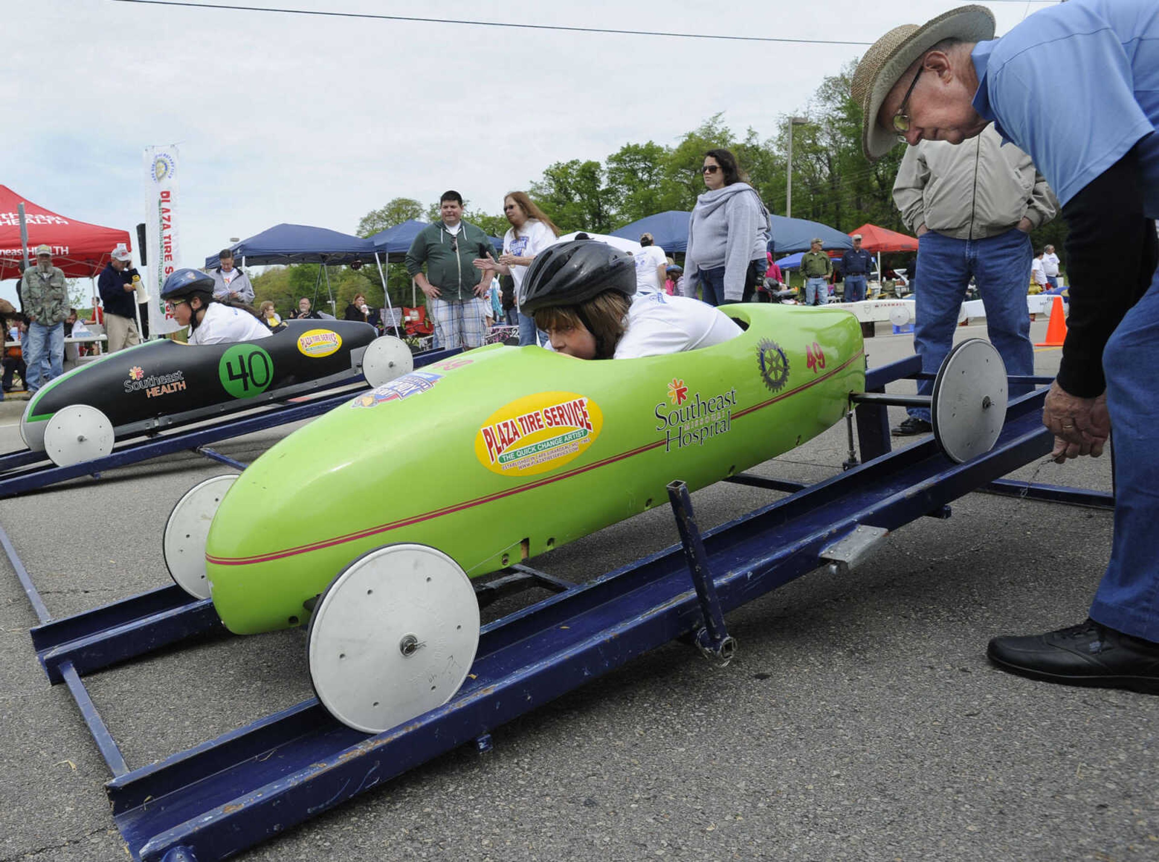 FRED LYNCH ~ flynch@semissourian.com
Moe Sandfort starts a race with Tristan Rhodes of Jackson, front, and Parker Valencia of Cape Girardeau during the Soap Box Derby sponsored by the Cape Girardeau Rotary Club on Saturday, May 3, 2014 in Cape Girardeau.