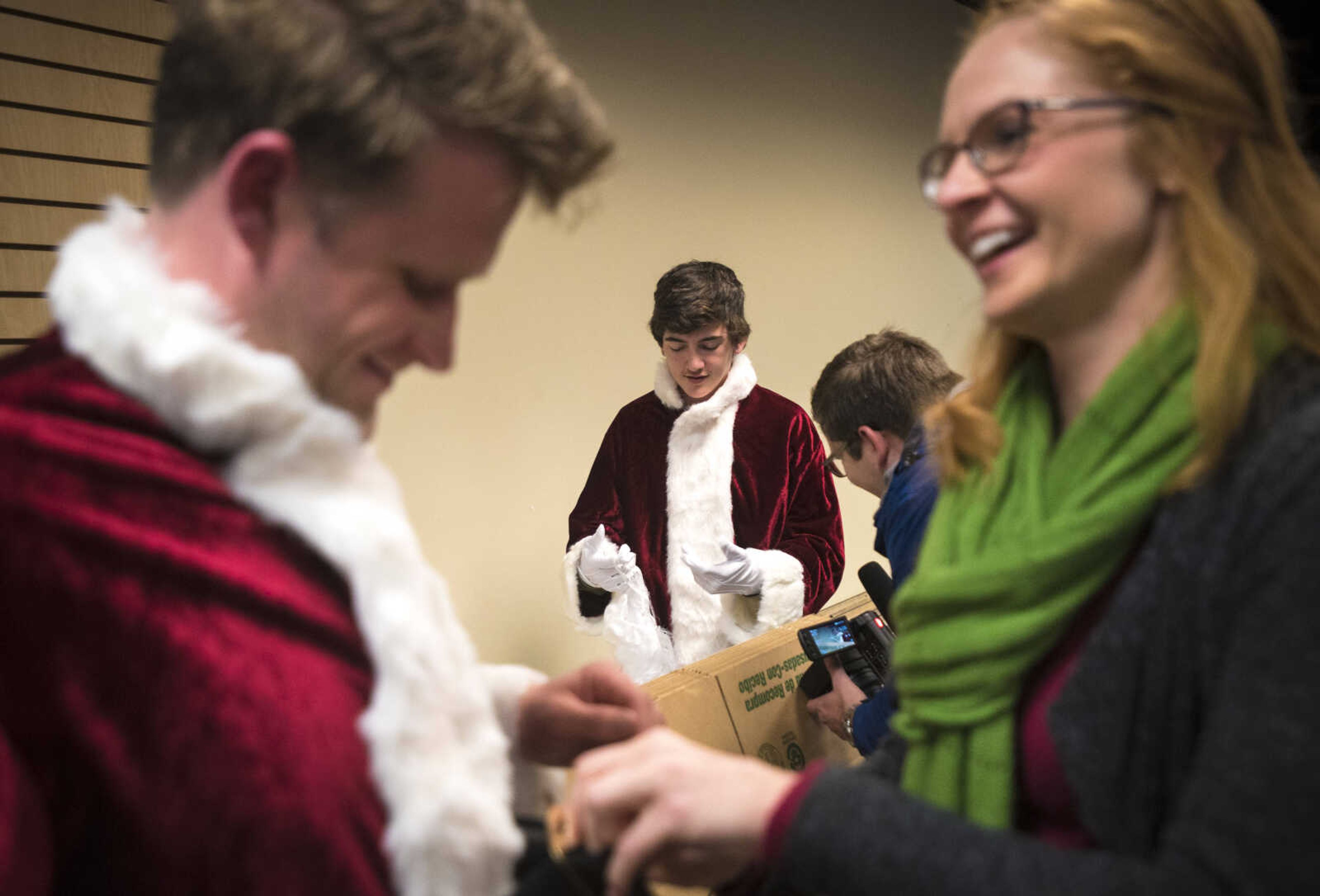 Santa's get ready during the Jaycee Toybox delivery on Thursday, Dec. 21, 2017, in Cape Girardeau.