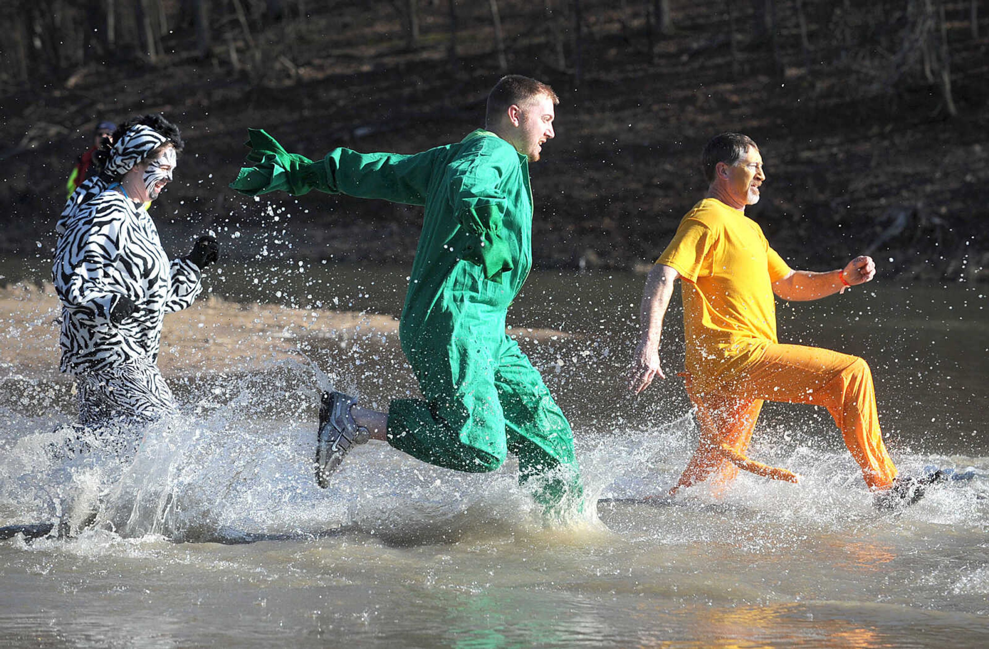 LAURA SIMON ~ lsimon@semissourian.com
People plunge into the cold waters of Lake Boutin Saturday afternoon, Feb. 2, 2013 during the Polar Plunge at Trail of Tears State Park. Thirty-six teams totaling 291 people took the annual plunge that benefits Special Olympics Missouri.