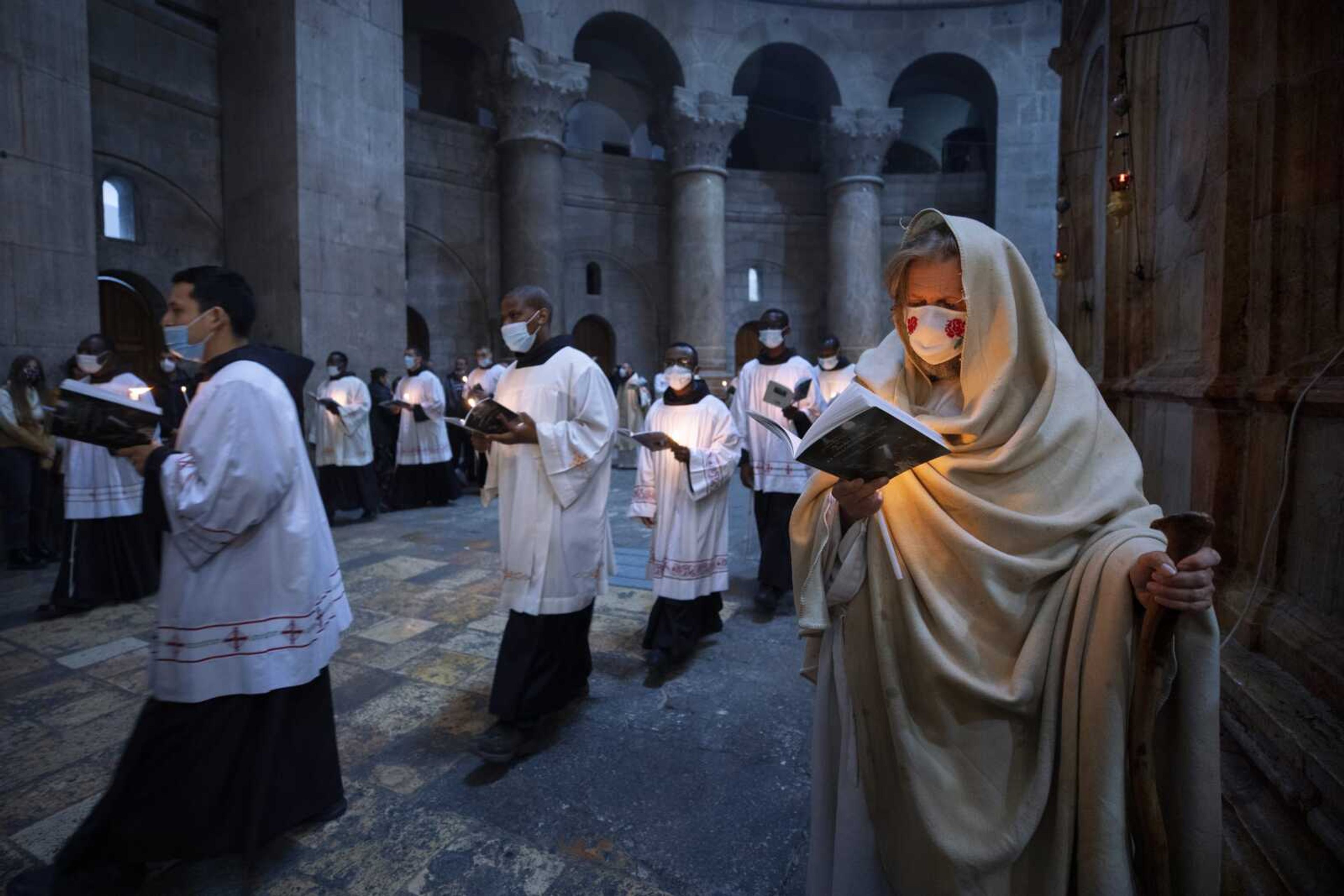 Priests circle the Edicule during Easter Sunday Mass led by the Latin Patriarch at the Church of the Holy Sepulchre, where many Christians believe Jesus was crucified, buried and rose from the dead, on Sunday in the Old City of Jerusalem.