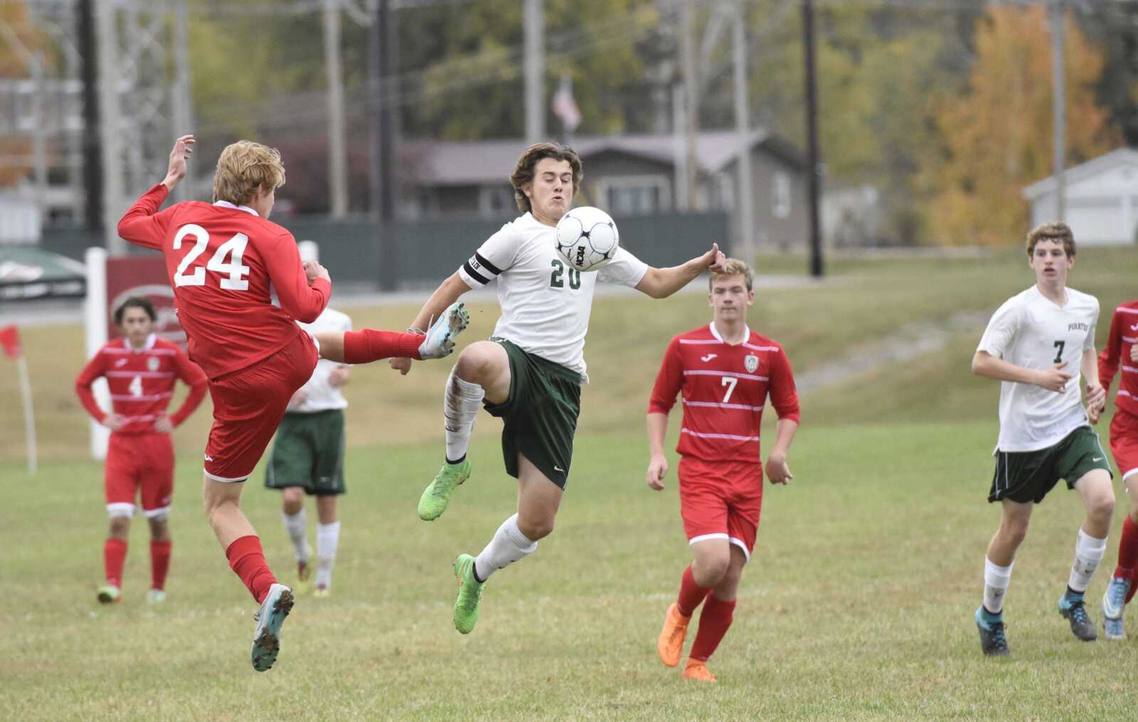 Perryville's Eann Bergman (20) fwins possession against a Bishop DuBourg defender in the seccond half of a Class 2 sectional Saturday in Perryville.