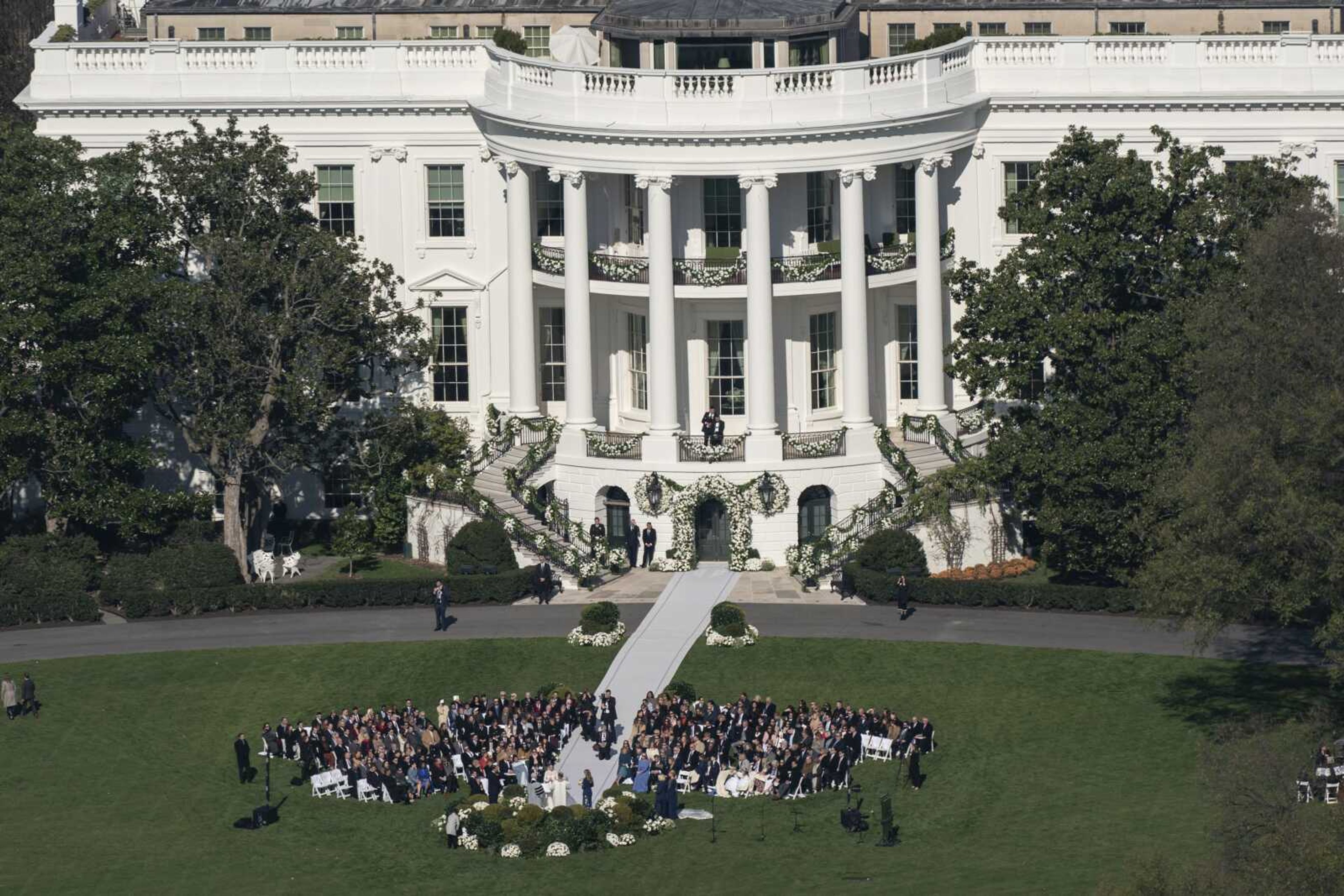 President Joe Biden's granddaughter Naomi Biden and her fiance, Peter Neal, are married on the South Lawn of the White House on Saturday in Washington.